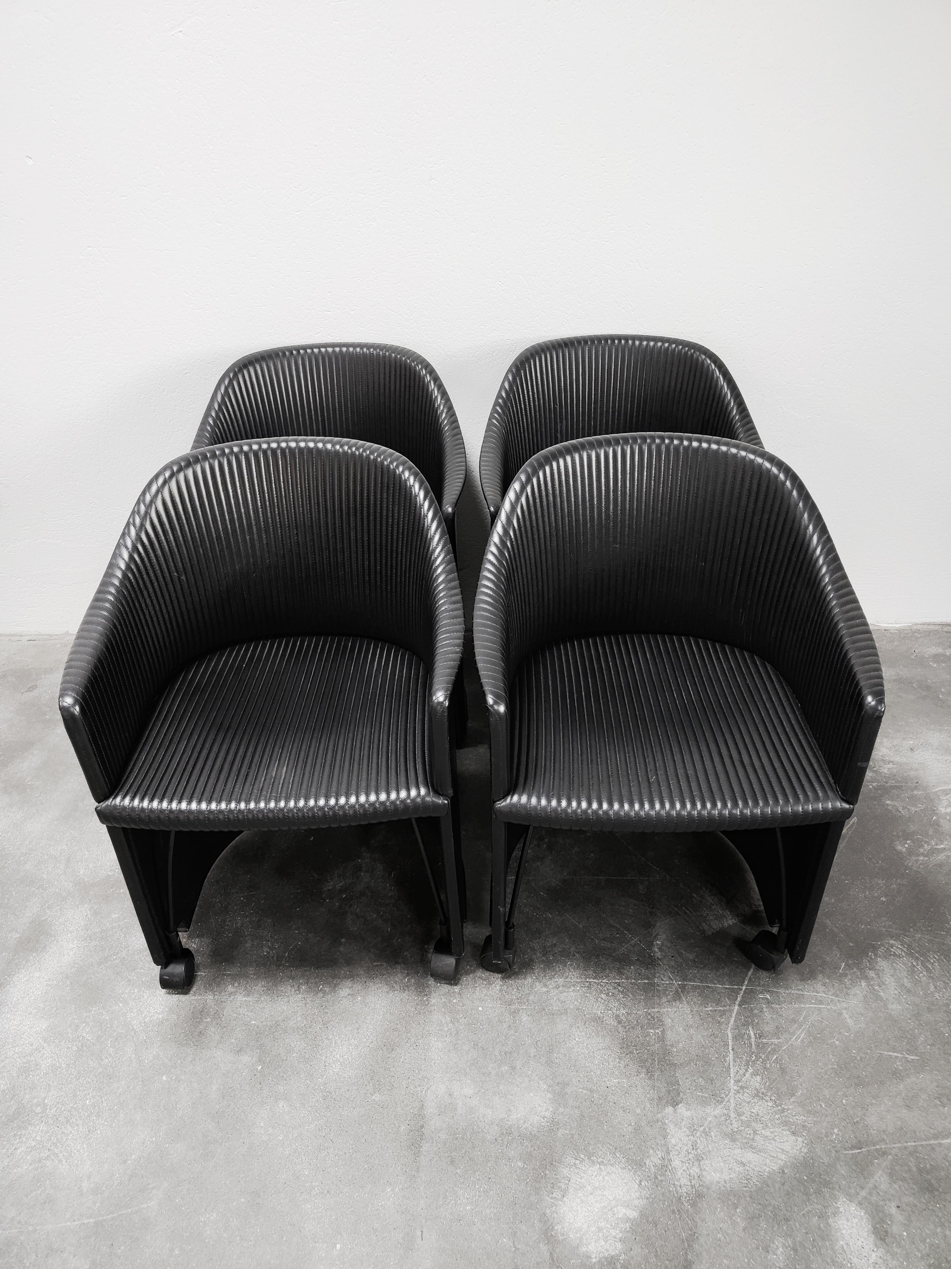 In this listing you will find set of four of very rare leather armchairs designed by Italian duo Afra and Tobia Scarpa. The armchairs were manufactured by Maxalto as a part of their Artona Collection in the mid 80s, and is known as Model 8552. They