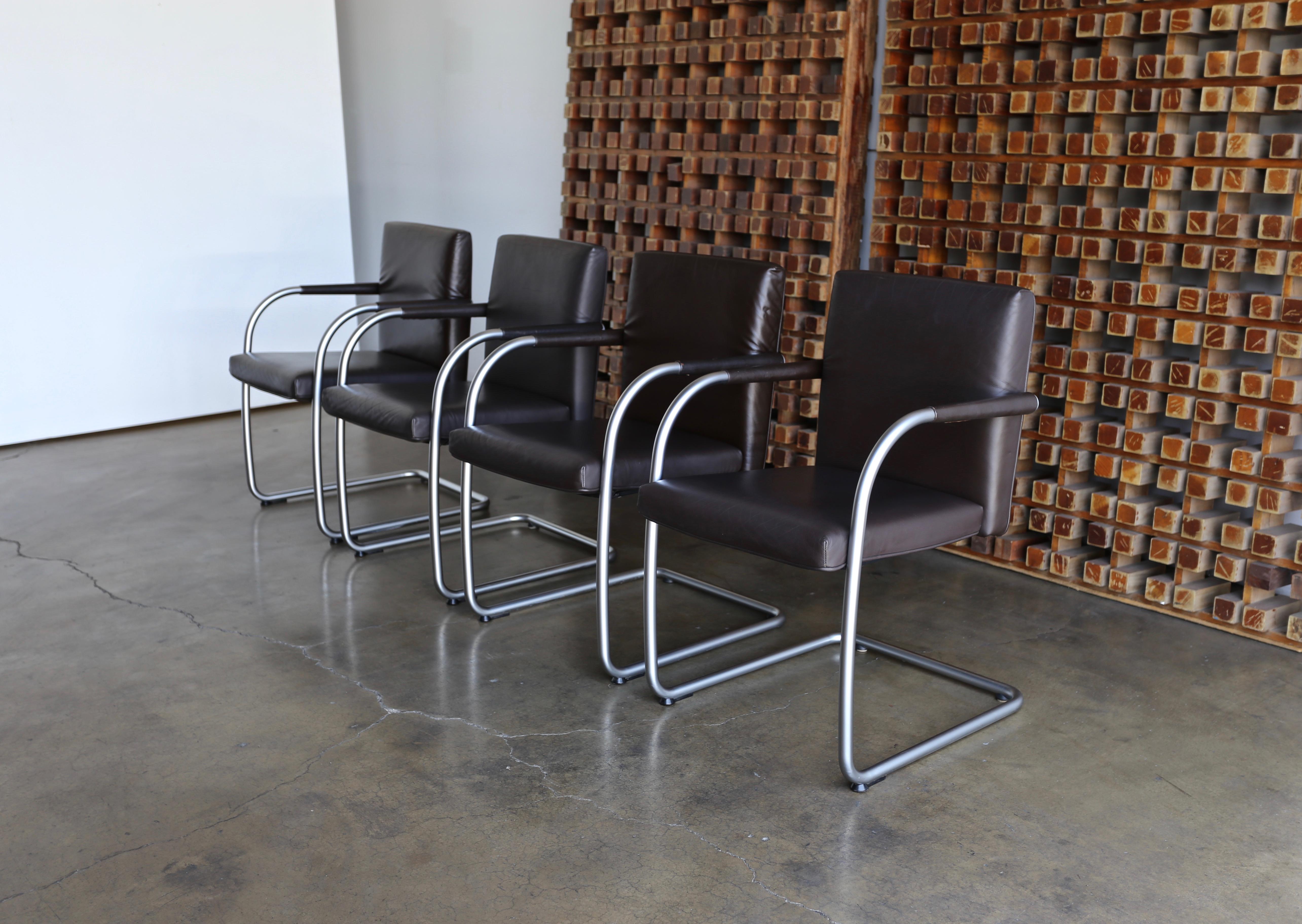 Set of four brown leather armchairs by Antonio Citterio & Glen Oliver Low for Vitra, 1999.