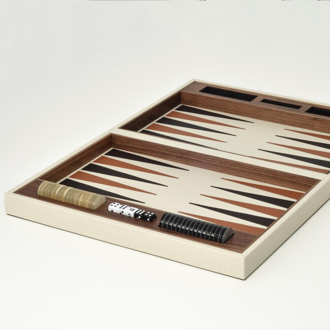 Dynamic and unpredictable, this backgammon boardgame set is a lavish accent piece for both modern and traditional interiors. The set box is crafted exclusively of Canaletto walnut, with the interior boasting a colorful design with black and