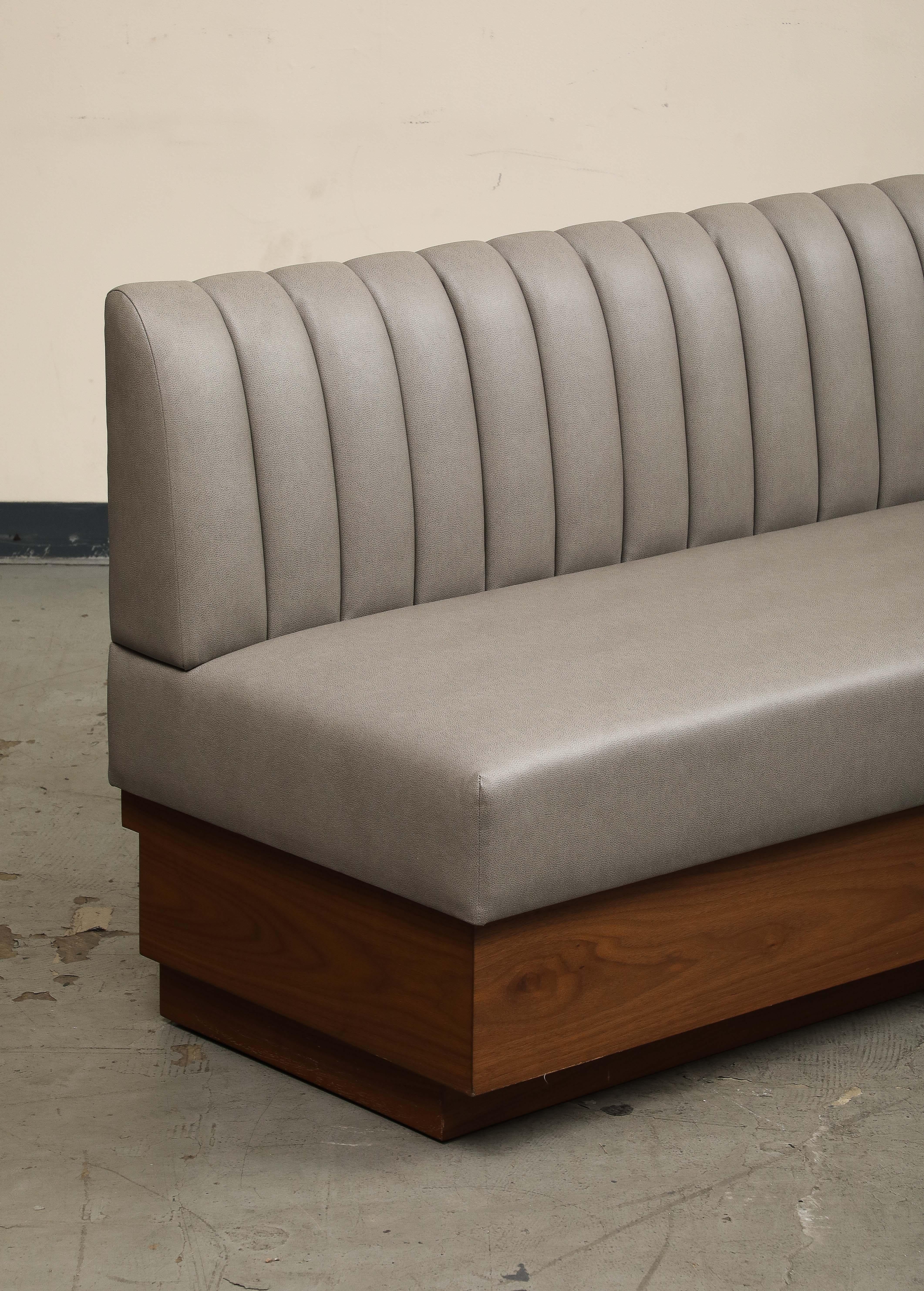American Leather Barrel Tufted Banquette on Walnut Base by ROOM