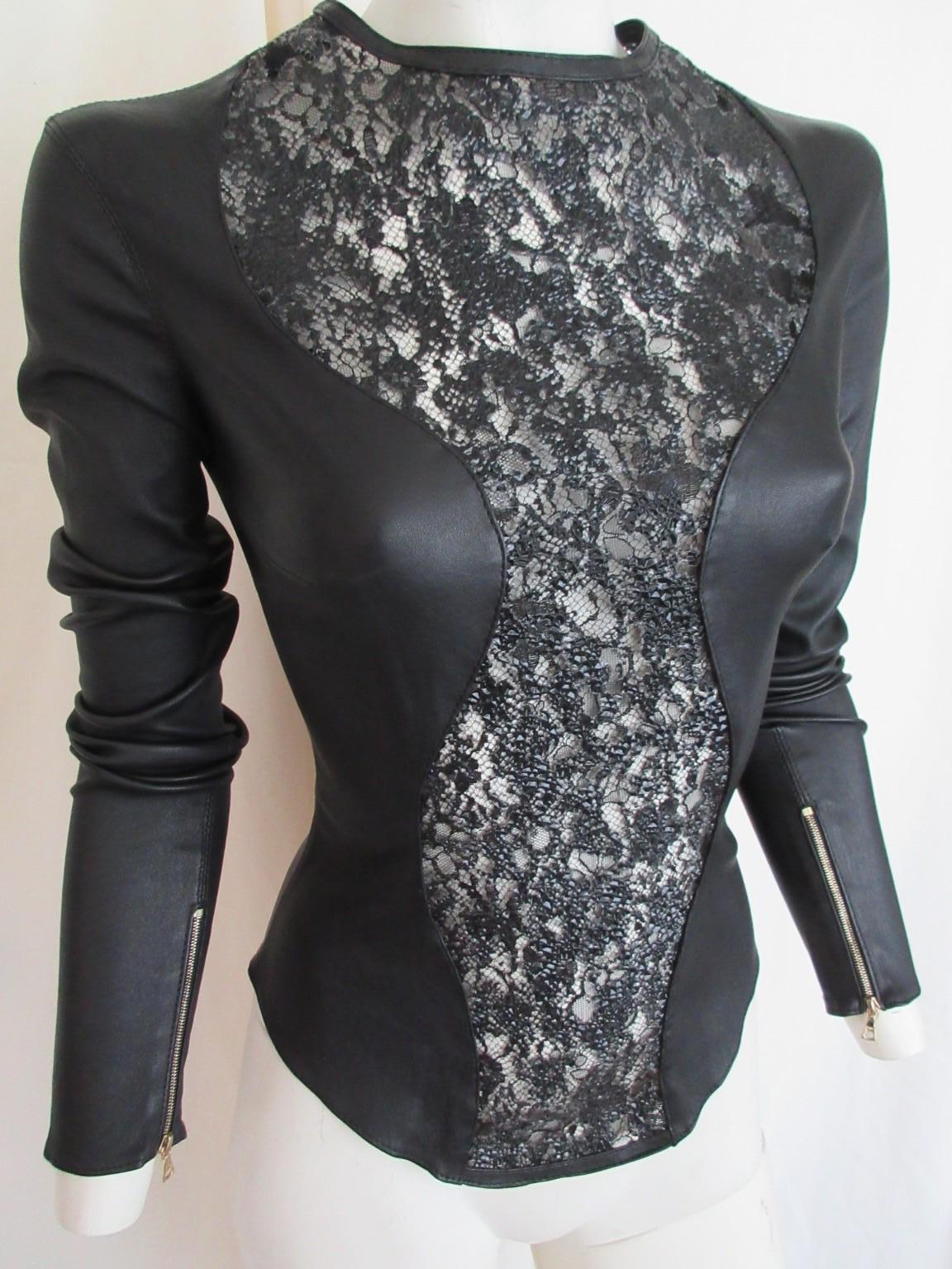 Fabulous unique sexy top in black color made of strech lamb leather 

We offer more exclusive leather and fur items, view our frontstore

Details:
Back golden zipperclosure and at sleeves
Stretch leather with embroided see trough front 
no