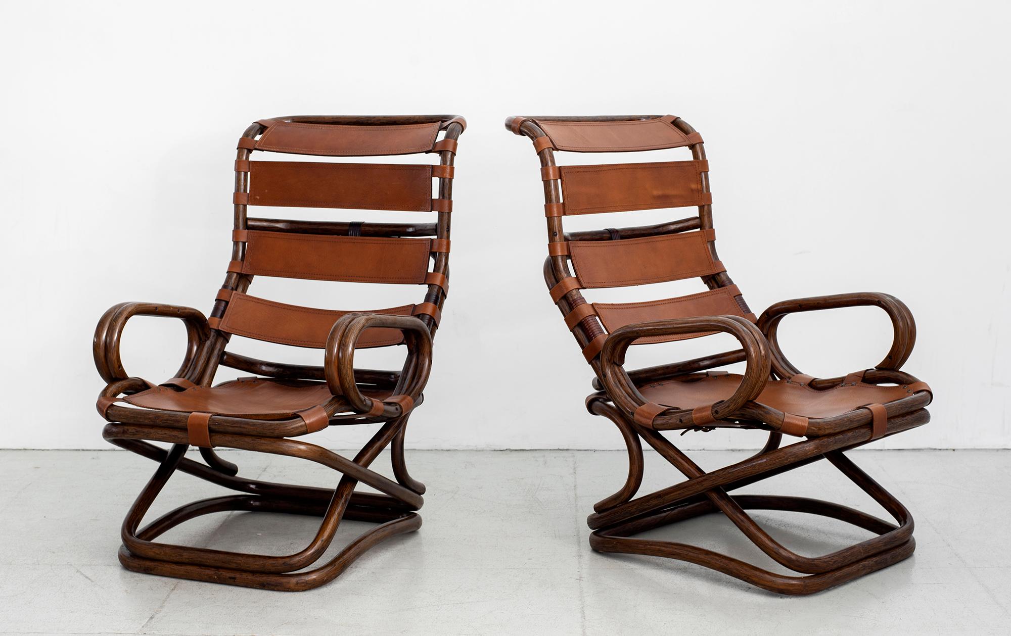 Great pair of bamboo and leather chairs, Italy, 1960s.
Dark bamboo with patina to leather.