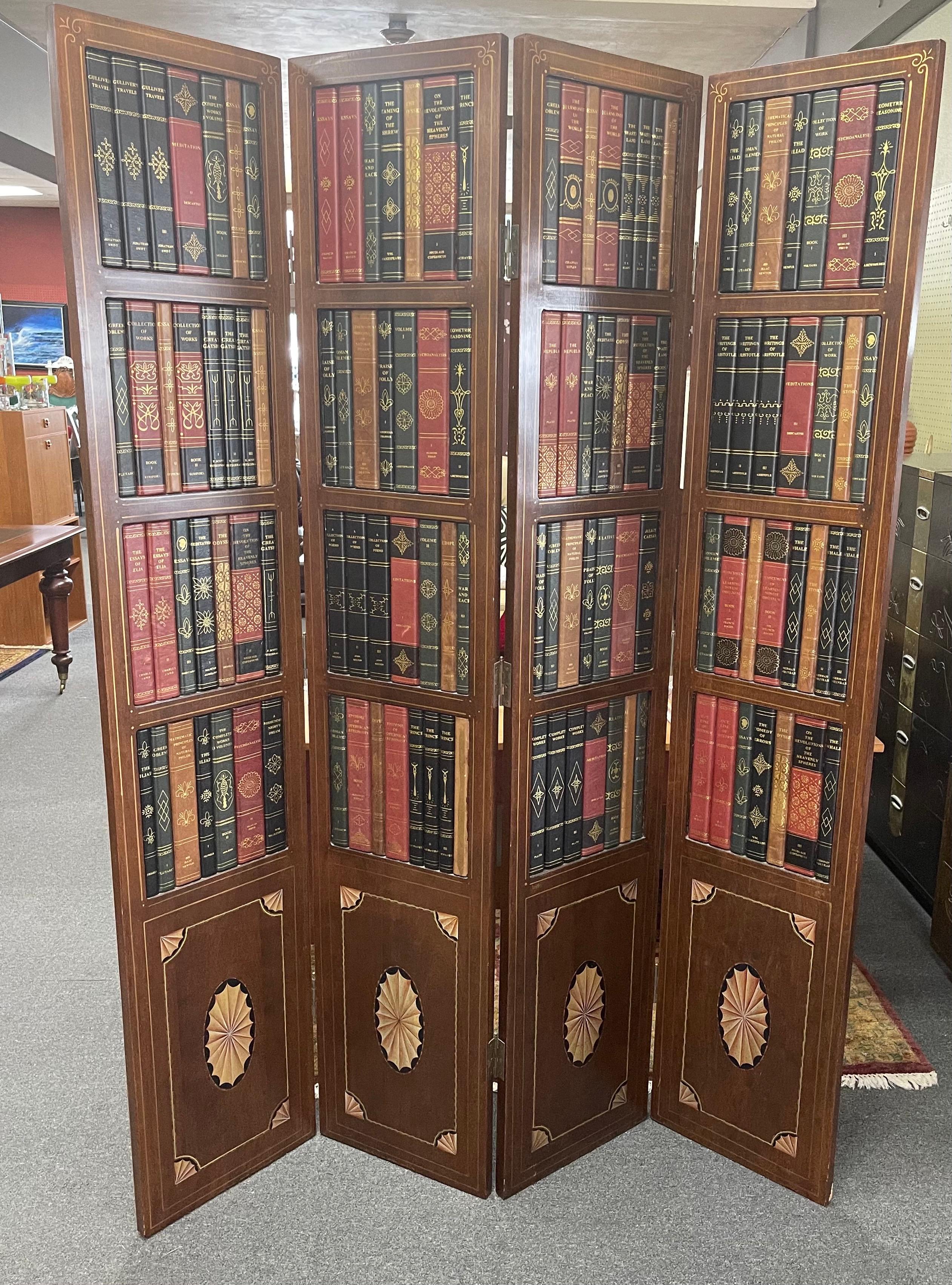 A beautiful leather bound library book four-panel folding screen / room divider by Maitland Smith, circa 1970s. The screen is made of mahogany with leather faux book bindings and has for 15