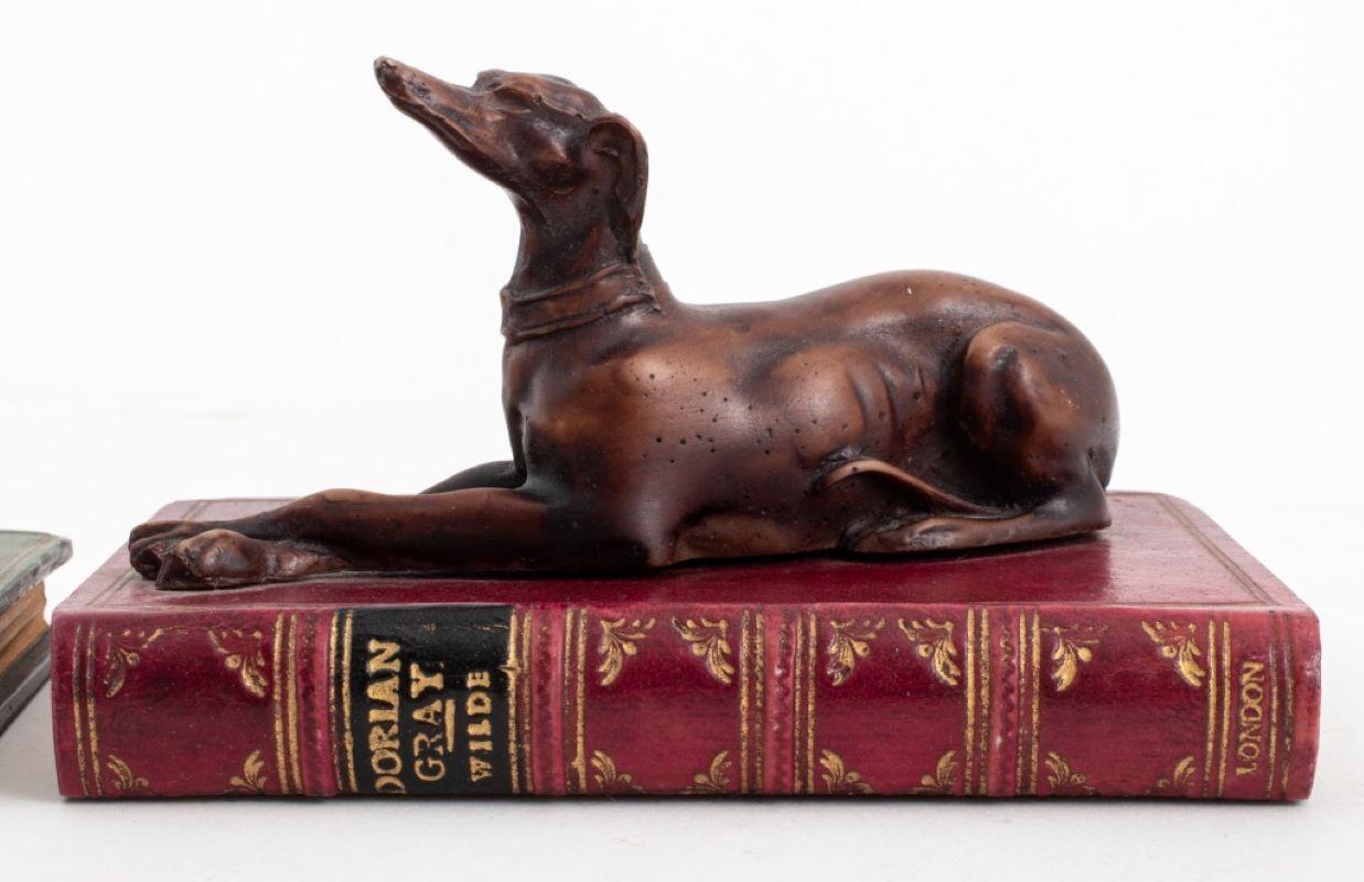 English Faux Book Composition Paperweight, 2 Group of two leather bounded books surmounted by a greyhound and a dachshund bronze patina composite sculpture, one with 