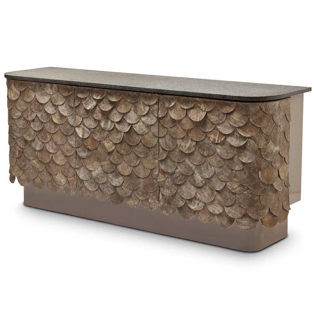 Inspired by the South African birds of prey, this contemporary and handmade server, by Egg Designs, is clad in a series of distressed leather circles, each one hand pinned to create an overlapping pattern reminiscent of a birds wing.
The carcass of