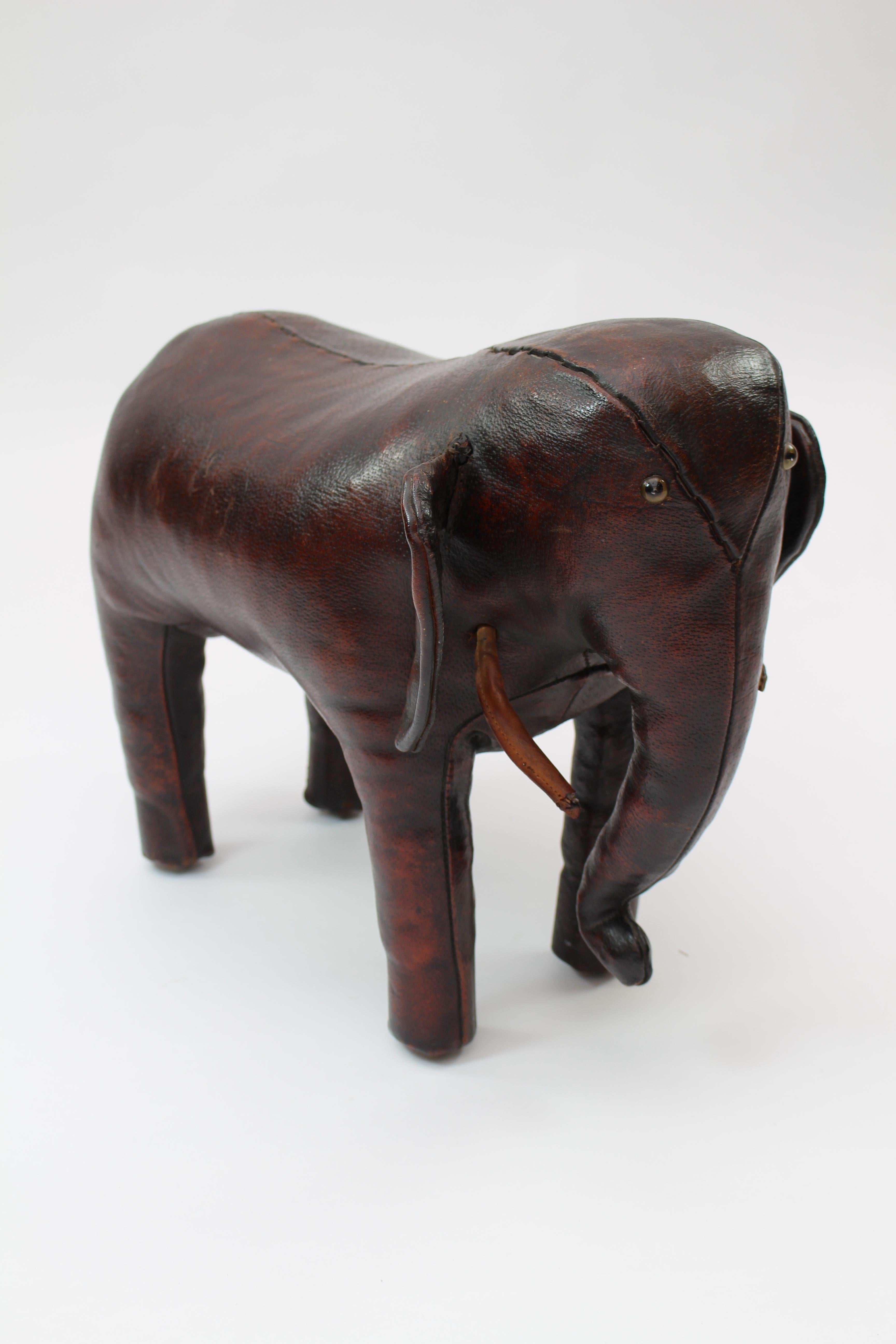 This brown leahter elephant by Omersa has a great patina and is stamped.