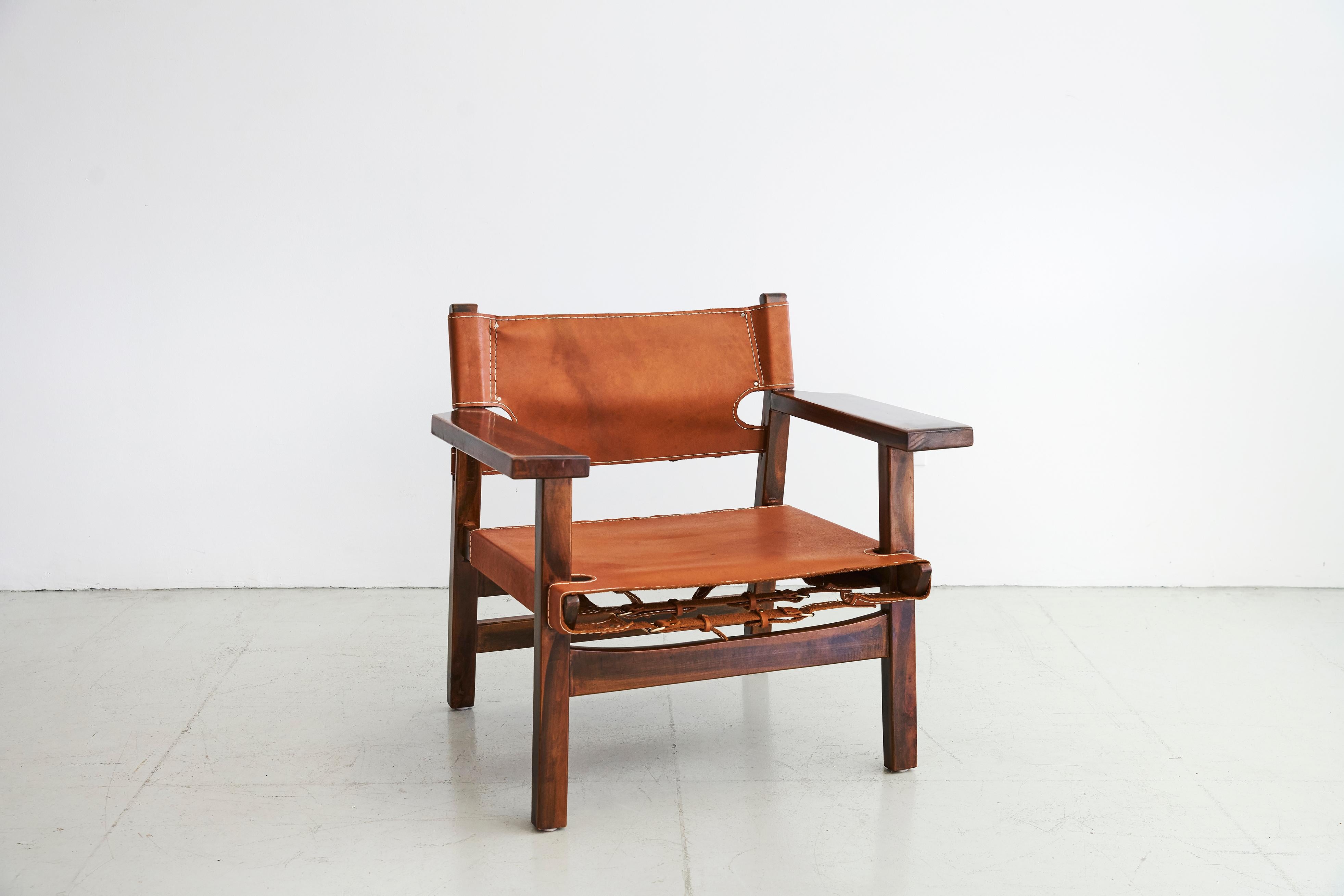 Rosewood and leather Campaign chairs in style of Borge Mogensen
Beautiful patina to leather and grain to wood.
 