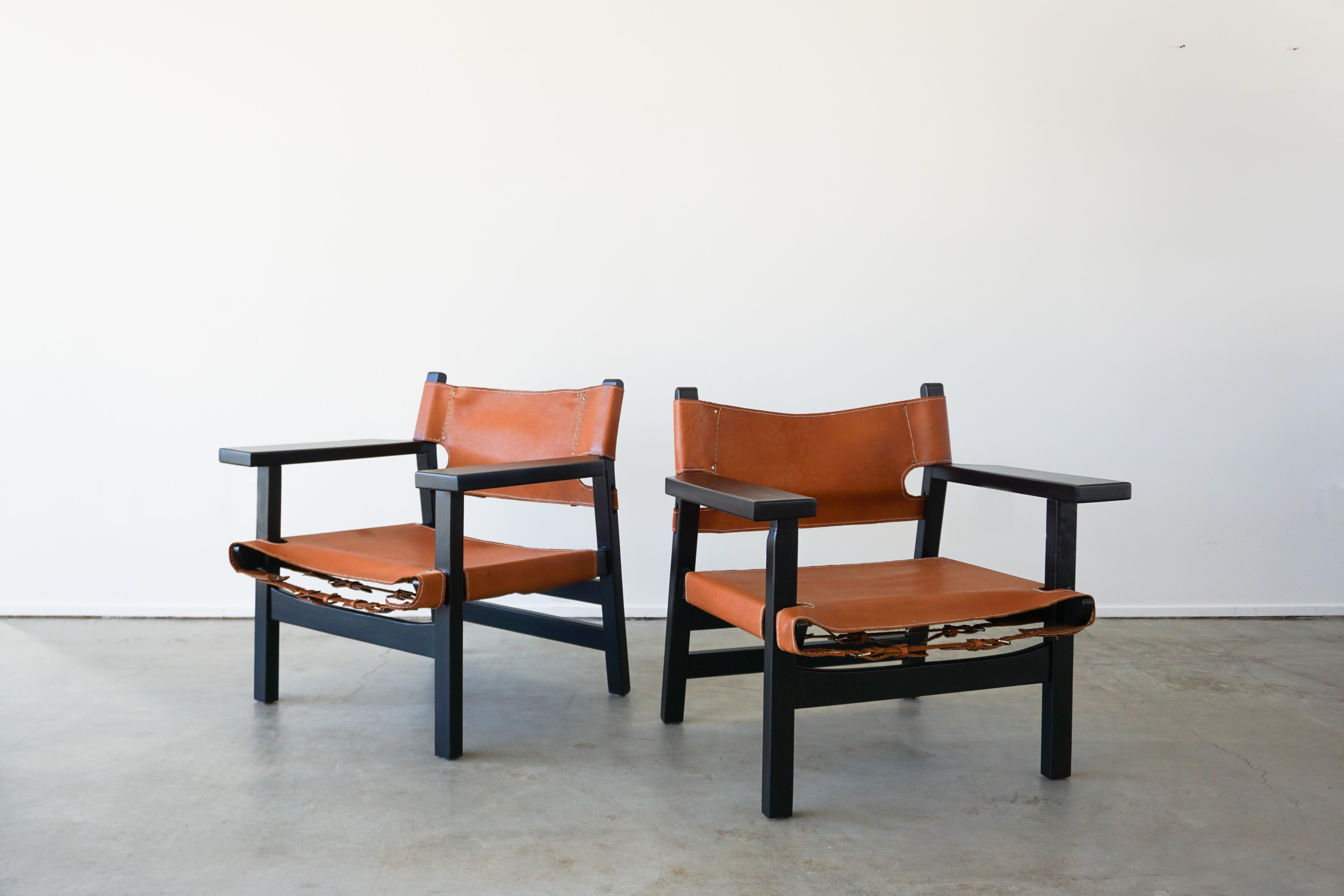 Leather Campaign chairs in style of Børge Mogensen stained in ebony.
Beautiful patina to leather with contrast stitching and buckle hardware.

    