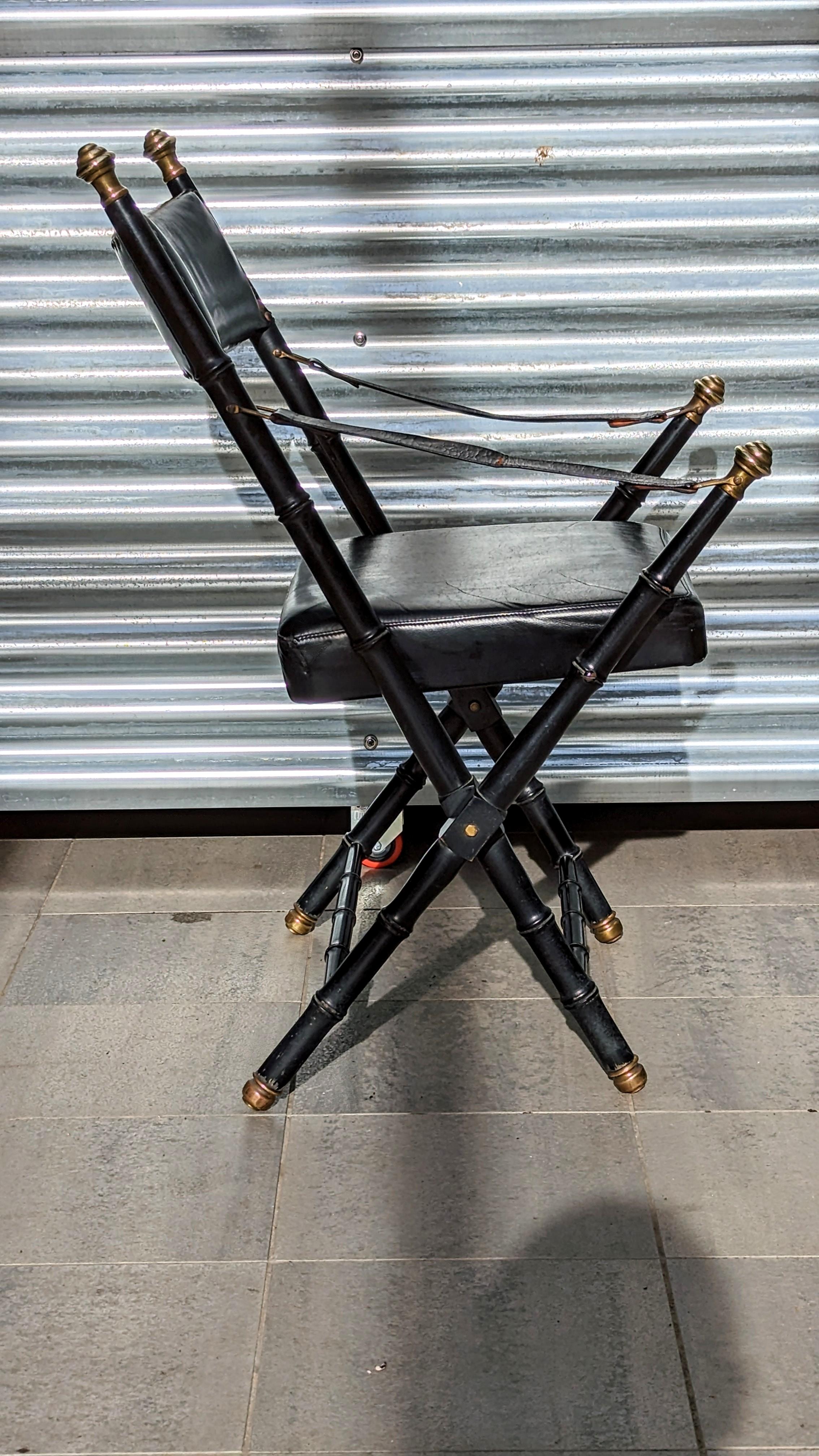 Beautiful and rare leather campaign folding chair manufactured by Valenti in 1960s.
This chair is particularly comfortable and very practical because it folds. Ideal for a small office, its turned bamboo wood design is very decorative and its brass