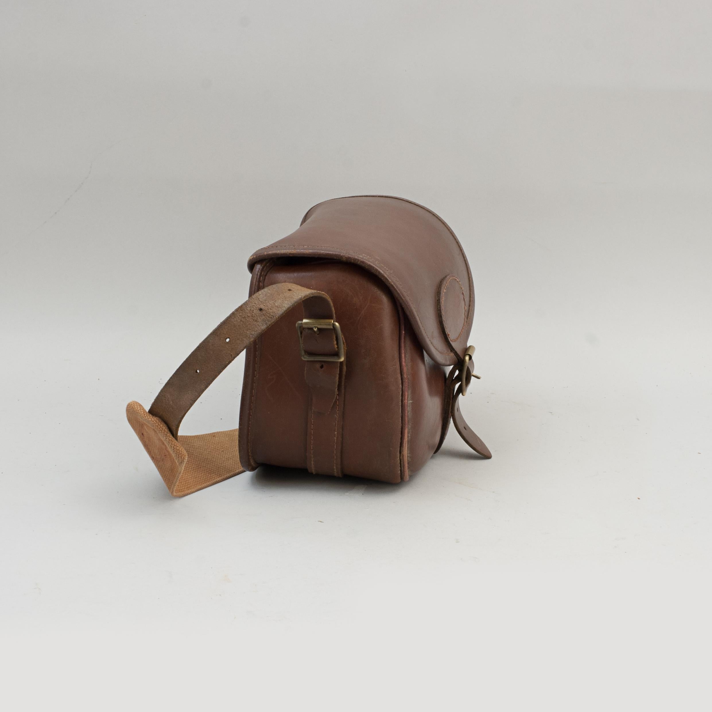 Vintage leather cartridge bag.
A good quality stiff leather cartridge bag. The bag is in good usable condition with brass fittings and an adjustable cotton web shoulder strap. A nice leather cartridge bag with no old owners initials. Maker