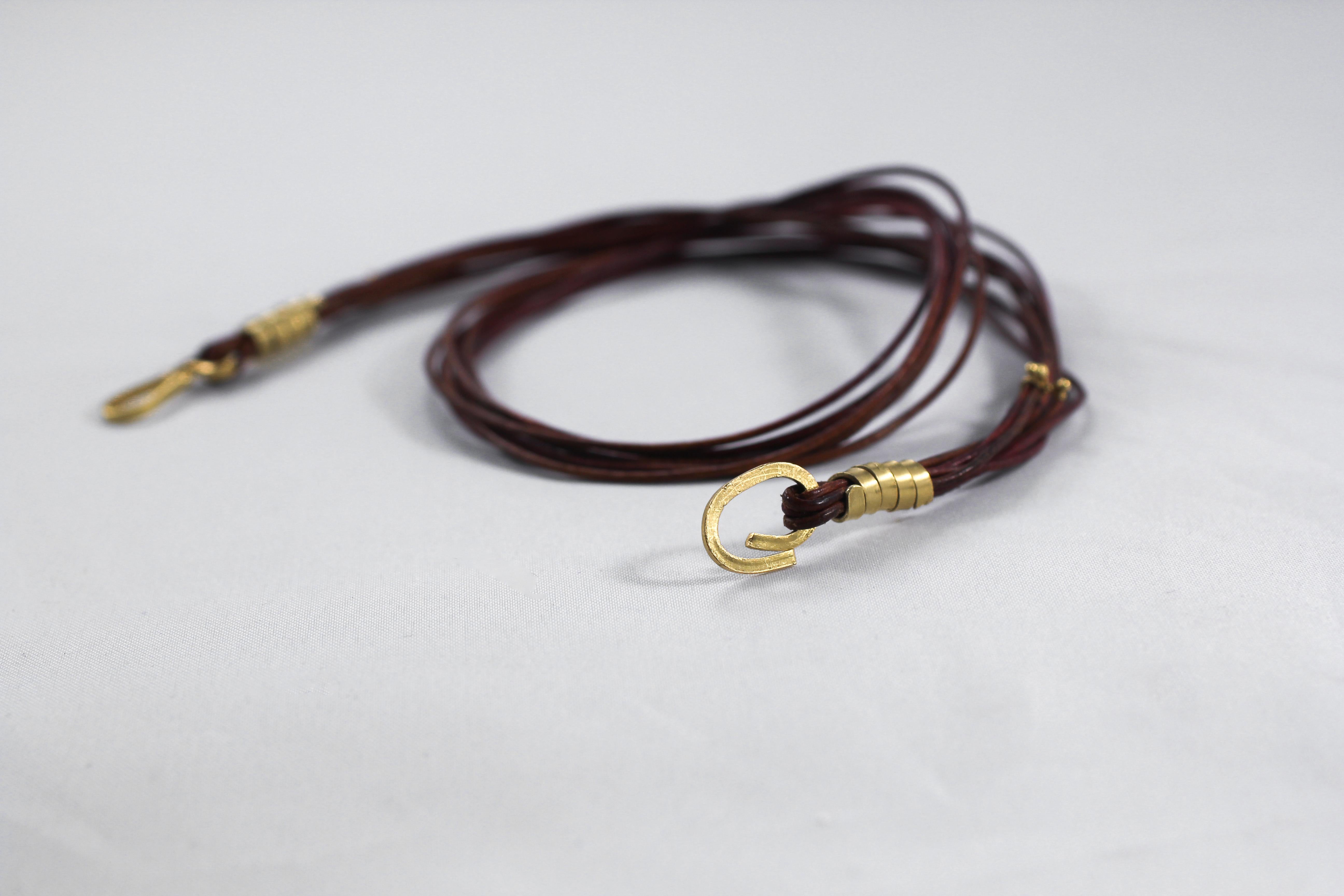 Leather multi-strand rope choker ending with an 18K gold handmade toggle clasp. Can be worn with our DANCE pendants. Created for modern living. Show your sense of whimsy with this stylish design.

The inspiration for this chain comes from nature,