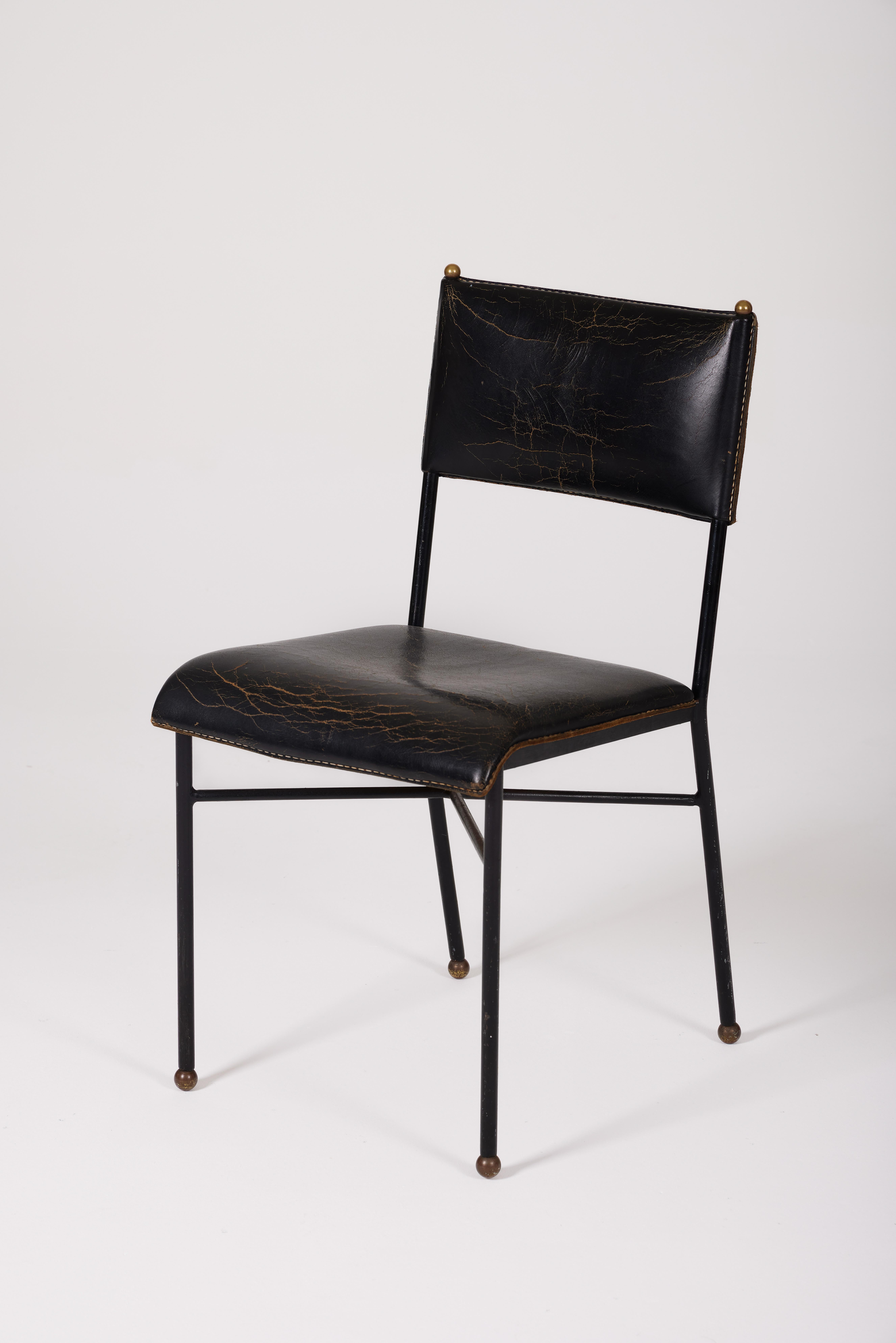 Office Chair by French Designer Jacques Adnet (1900-1984) from the 1940s. The base is metal, the seat and backrest are hand-stitched leather, and the details are brass. Jacques Adnet left an indelible mark on the design world with his distinctive