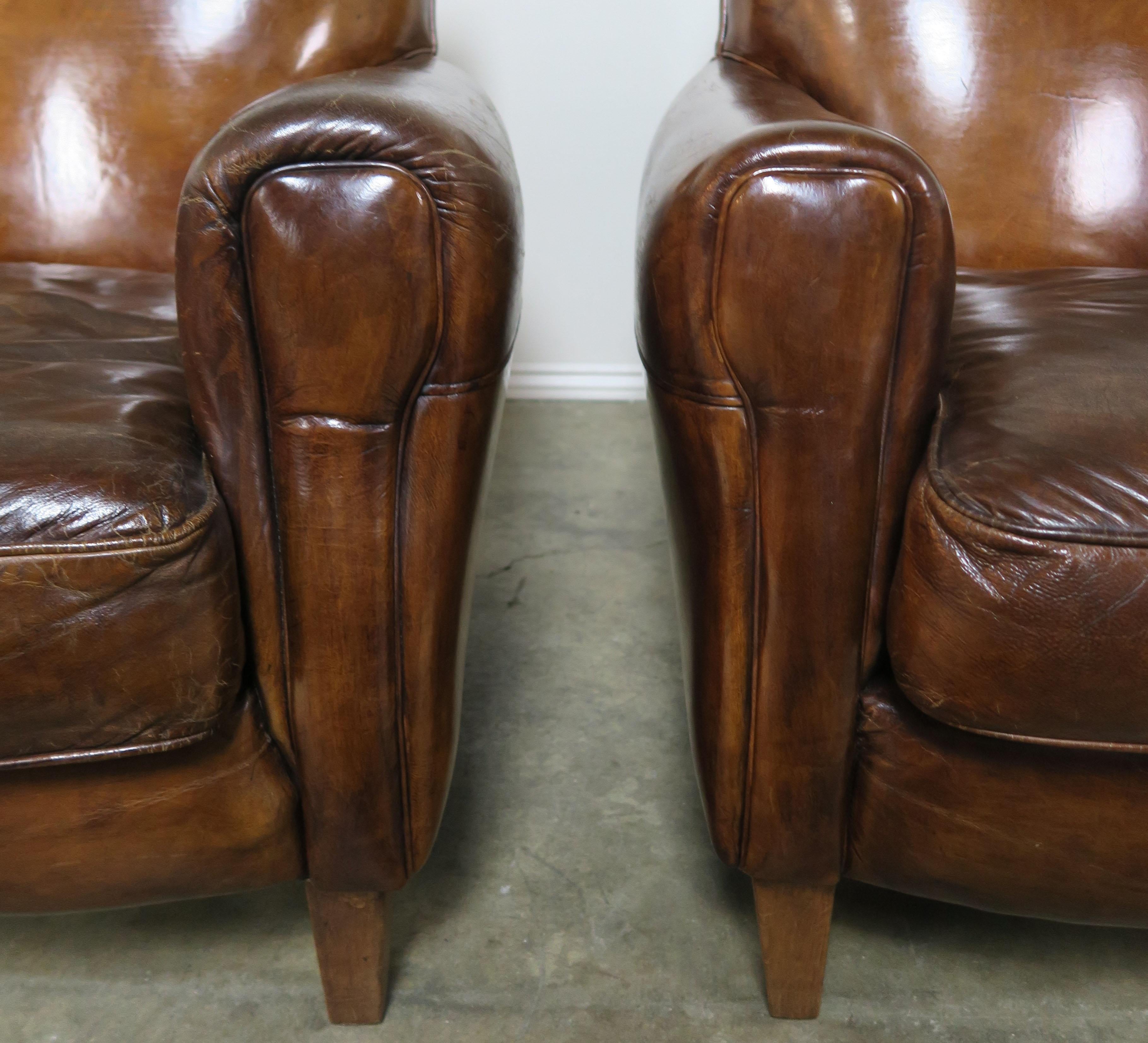Pair of French Leather Deco Armchairs, circa 1930 In Distressed Condition In Los Angeles, CA