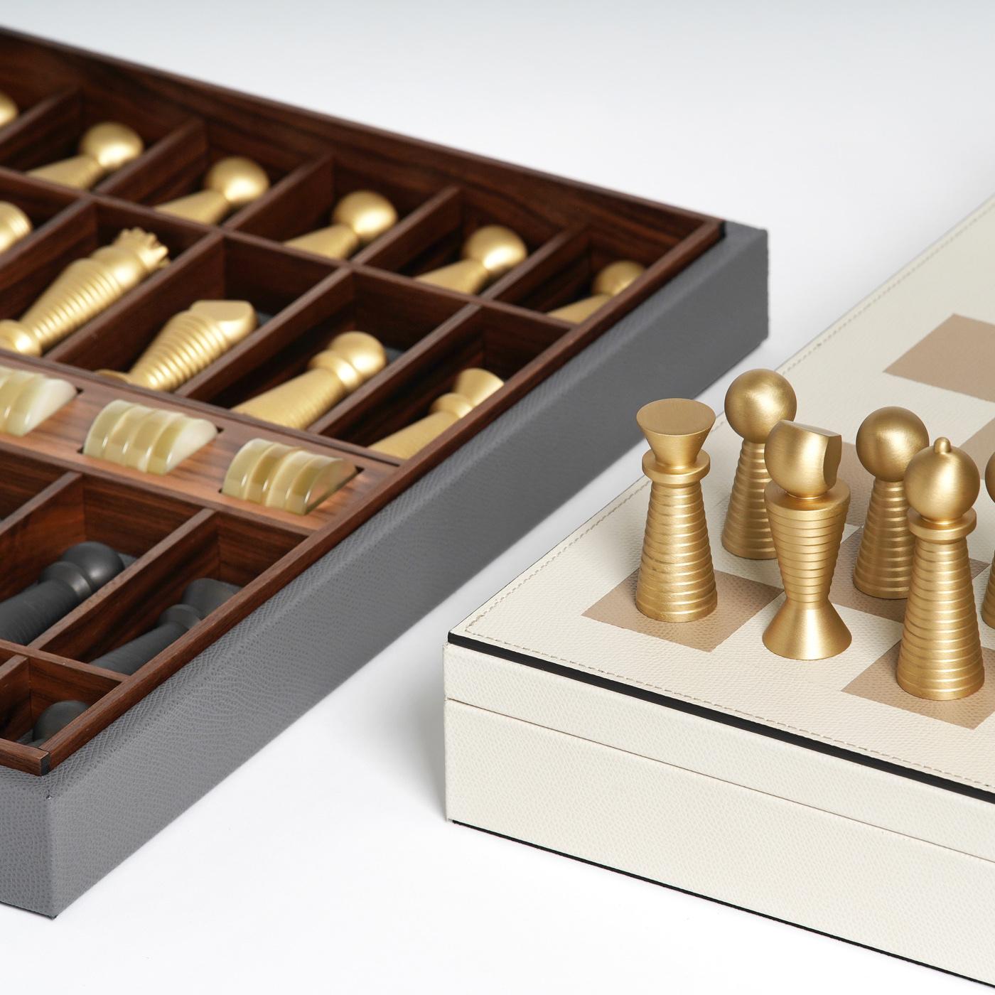 This chess and checkers board game set is a stunning decorative accent piece for both classical and modern interior decors. This piece is entirely crafted of walnut upholstered in gray leather, the top completed with white squares for the