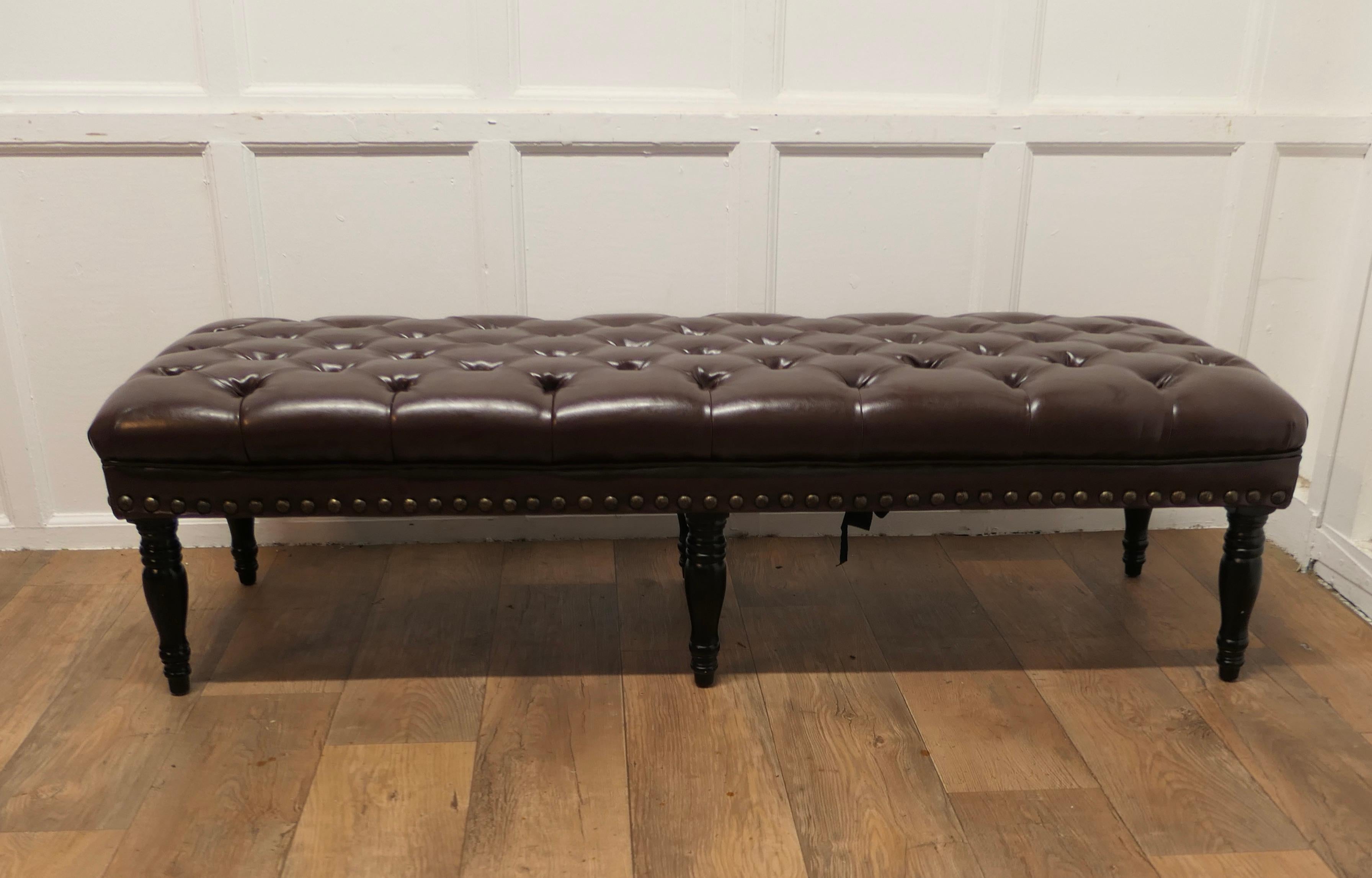 Leather Chesterfield Long Hearth Stool or Window Seat

This delightful piece is upholstered in brown leather, the leather is very thick  heavy quality and is very soft and pliable, it is set on turned legs. 
This is a beautiful piece of country