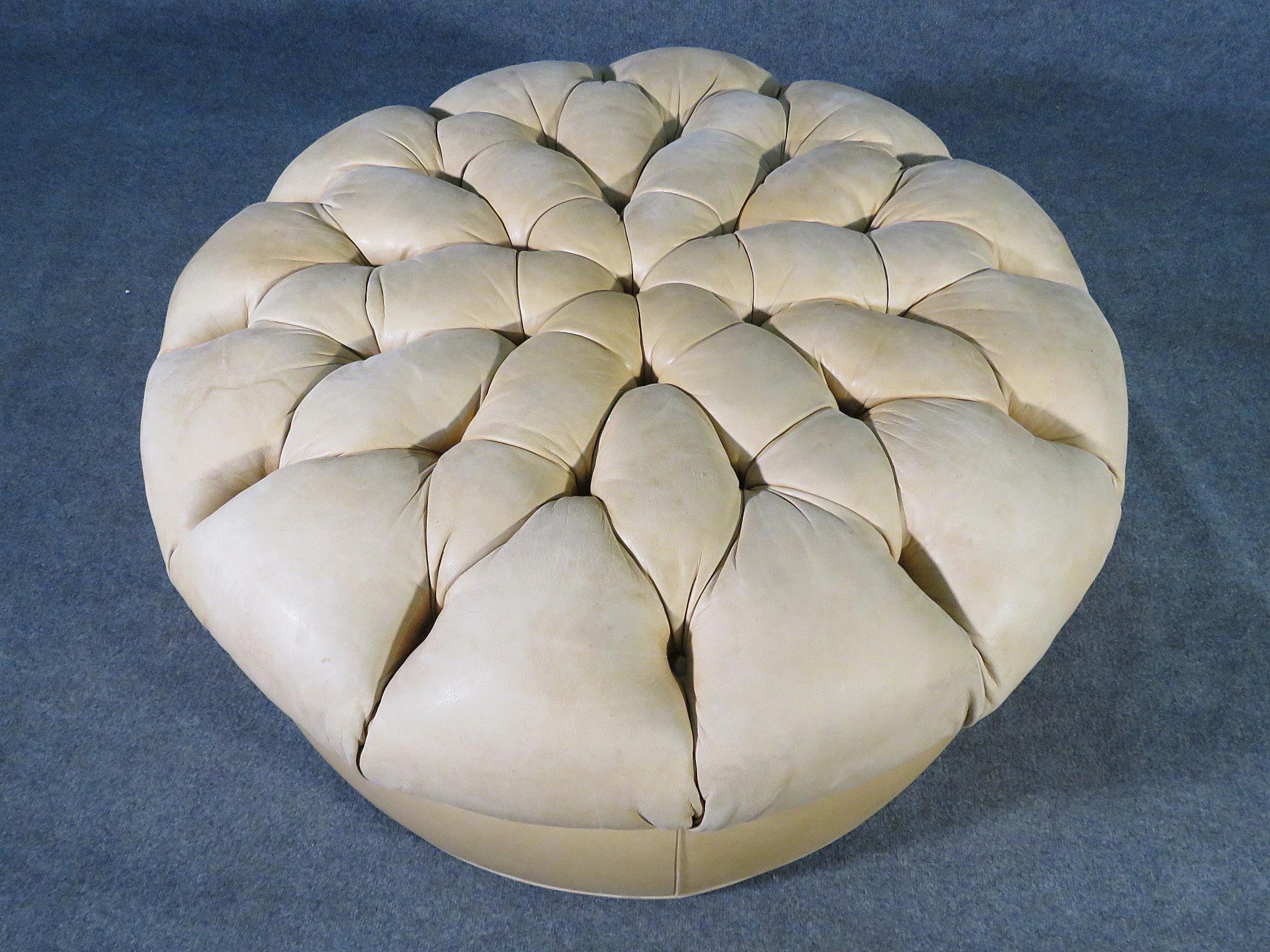 Round ottoman with tufted leather.
(Please confirm item location - NY or NJ - with dealer).
 
