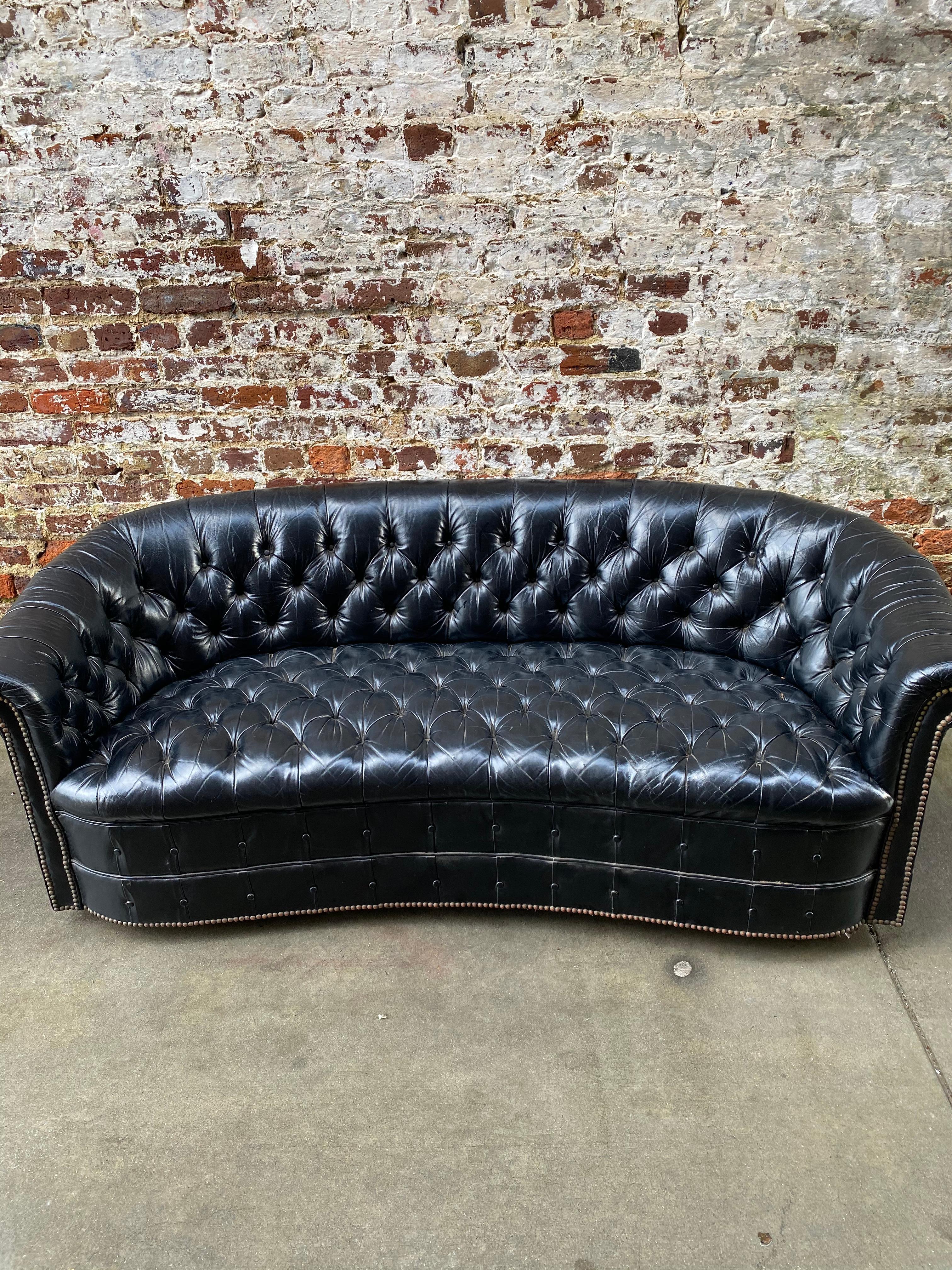 Leather Chesterfield sofa in black leather, early 20th century.