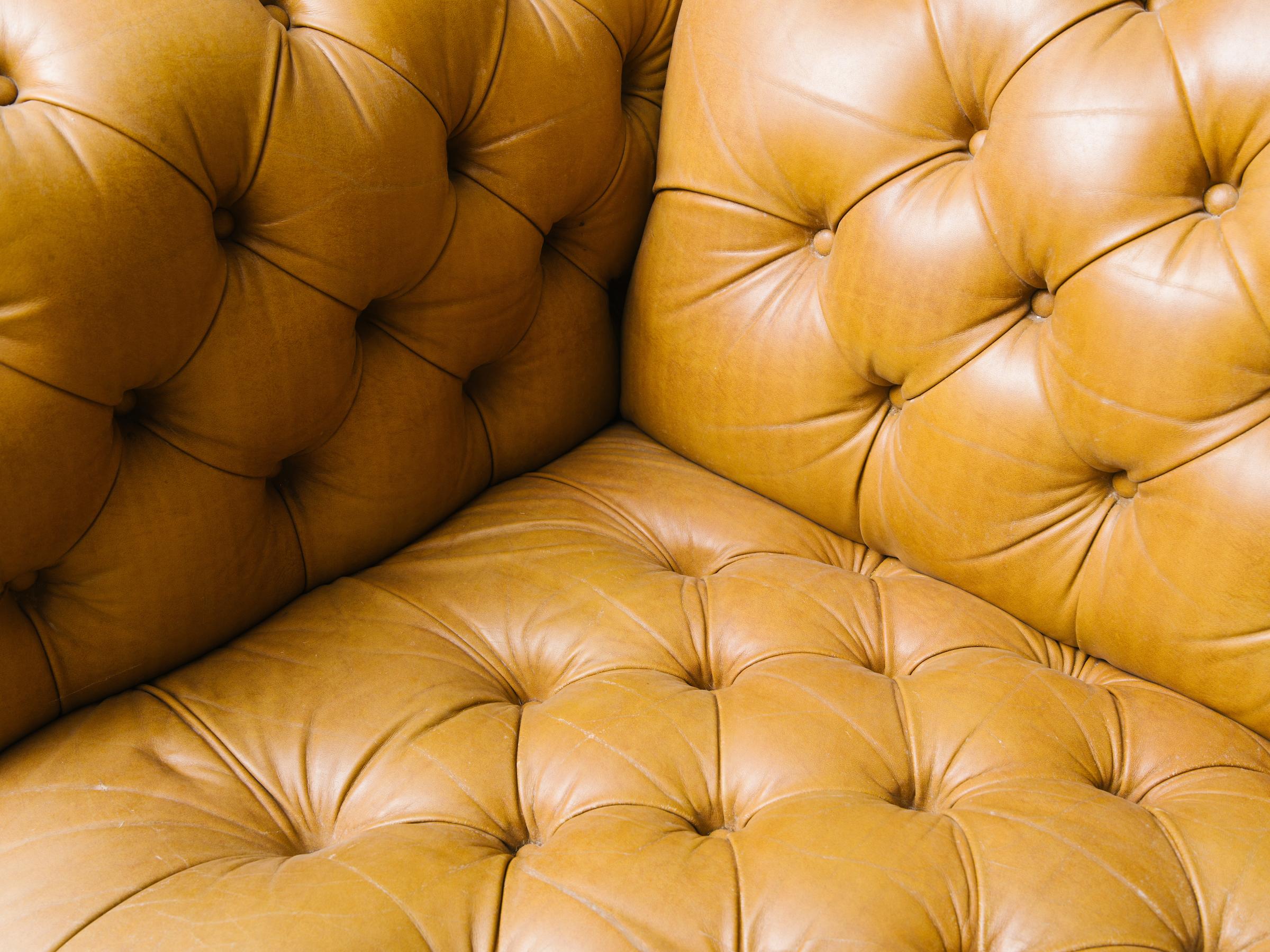 Leather chesterfield sofa with brass nailheads. Very heavy.
