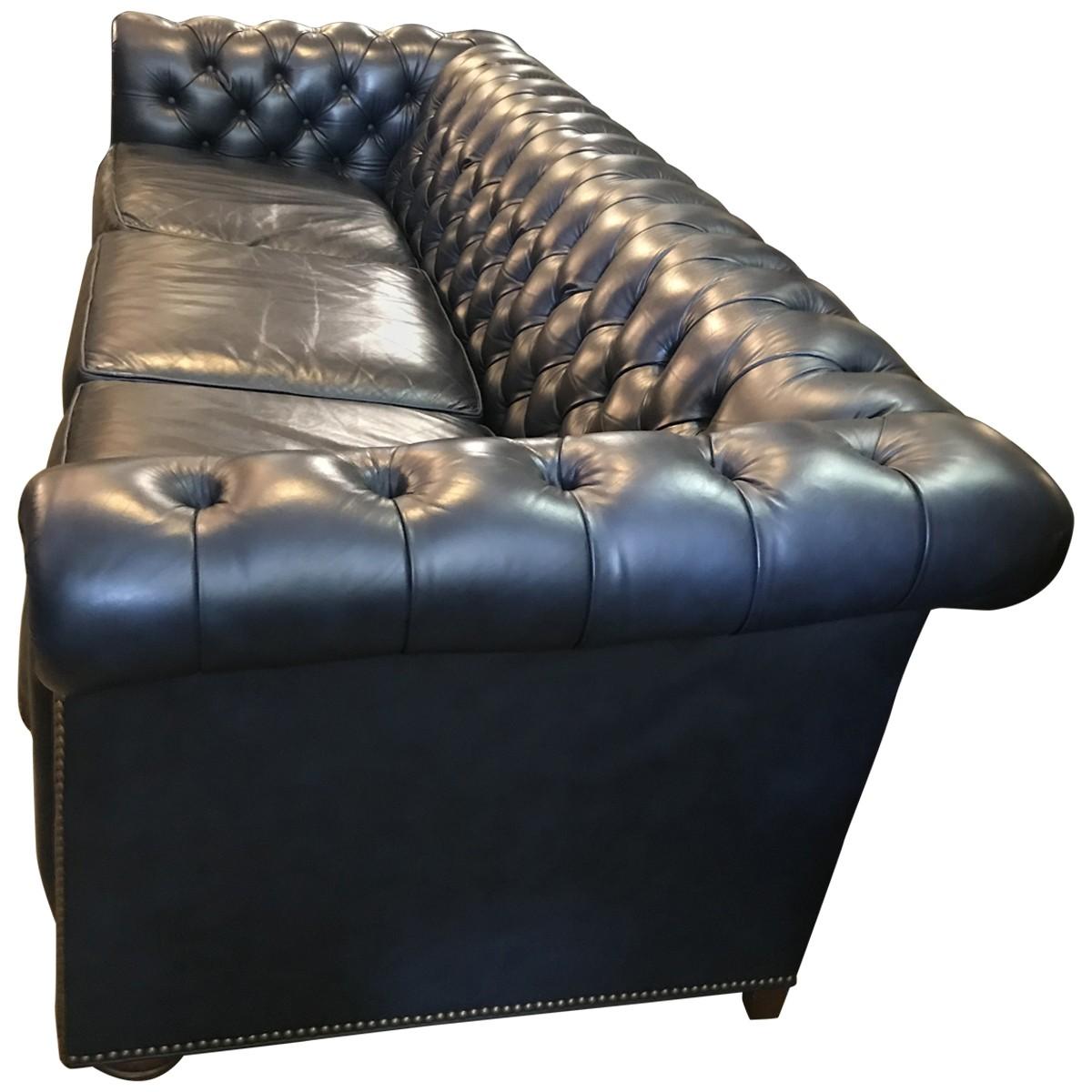Located in the highlands of Western North Carolina, Leathercraft has manufactured the finest leather seating available for over forty years. Plush and elegant, this commanding three-seat Chesterfield sofa comes clad in smooth navy blue leather