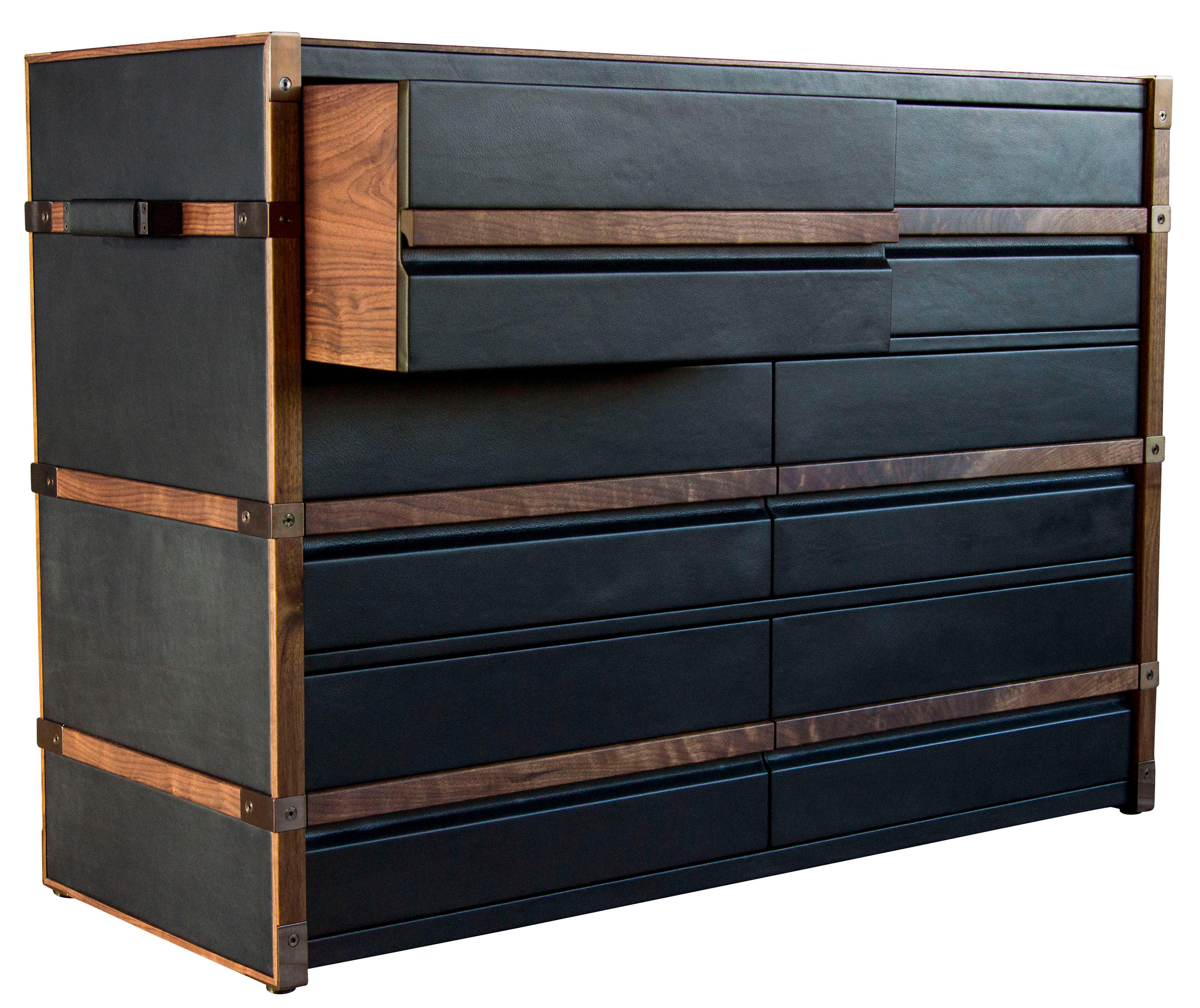 The Collingwood dresser evolved from the design of our luxurious trunks. Clad in rich European leather with hand burnished wood trim and darkened brass hardware, the Collingwood dresser is entirely made of components fashioned in-house from the