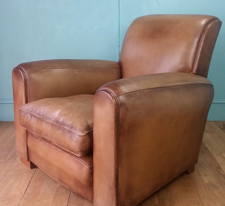 Leather club chair produced in the 1980's for a London Gentlemens club.
Lovely glamourous chair with soft high quality good condition leather very much in the style of a French 1950's version.
The leather has taken on a lovely authentic patina