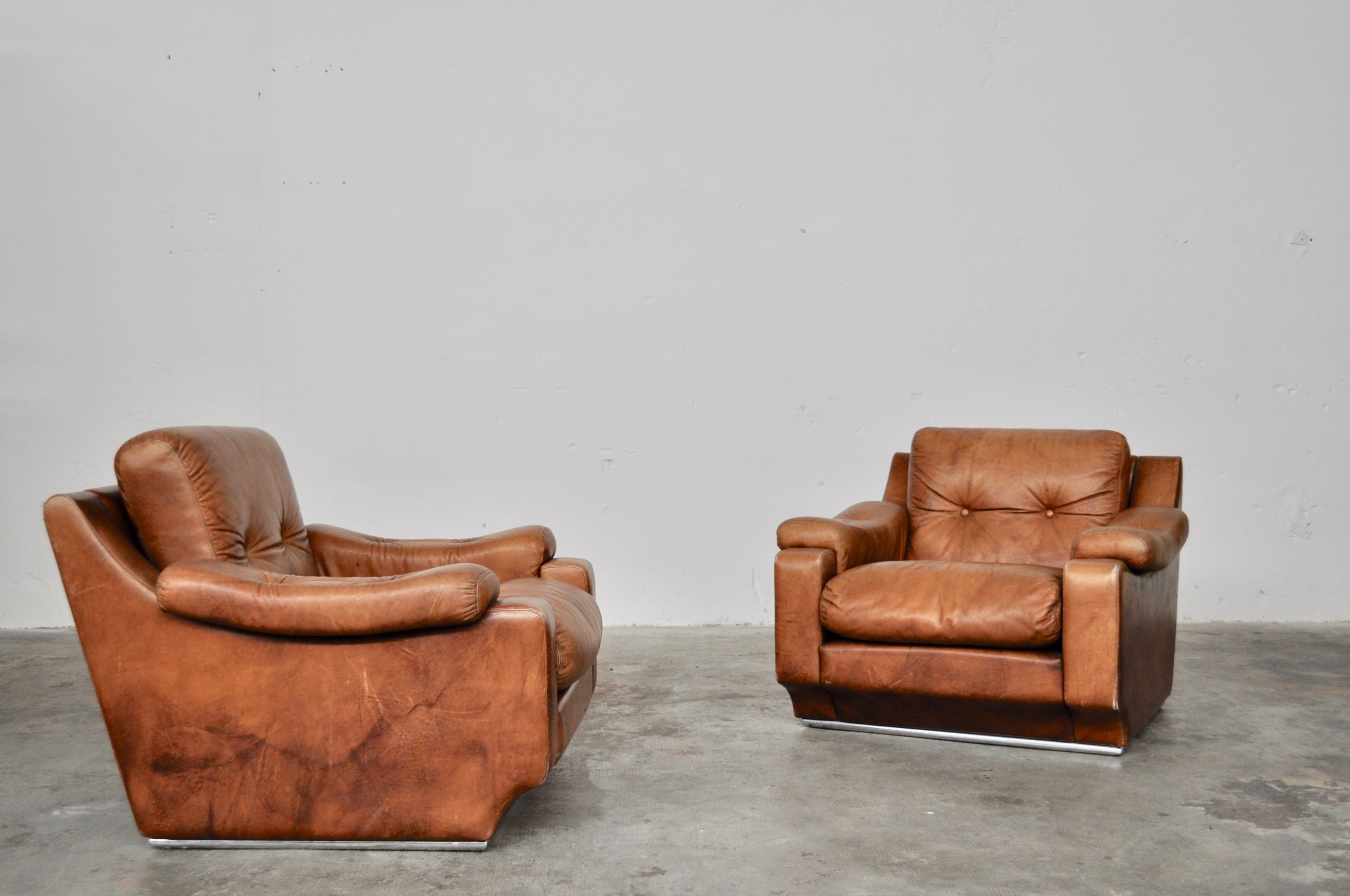 Leather armchairs with metal polished base structure, Italy, 1970s. Leather original in perfect conditions cognac color. Great comfort seats.