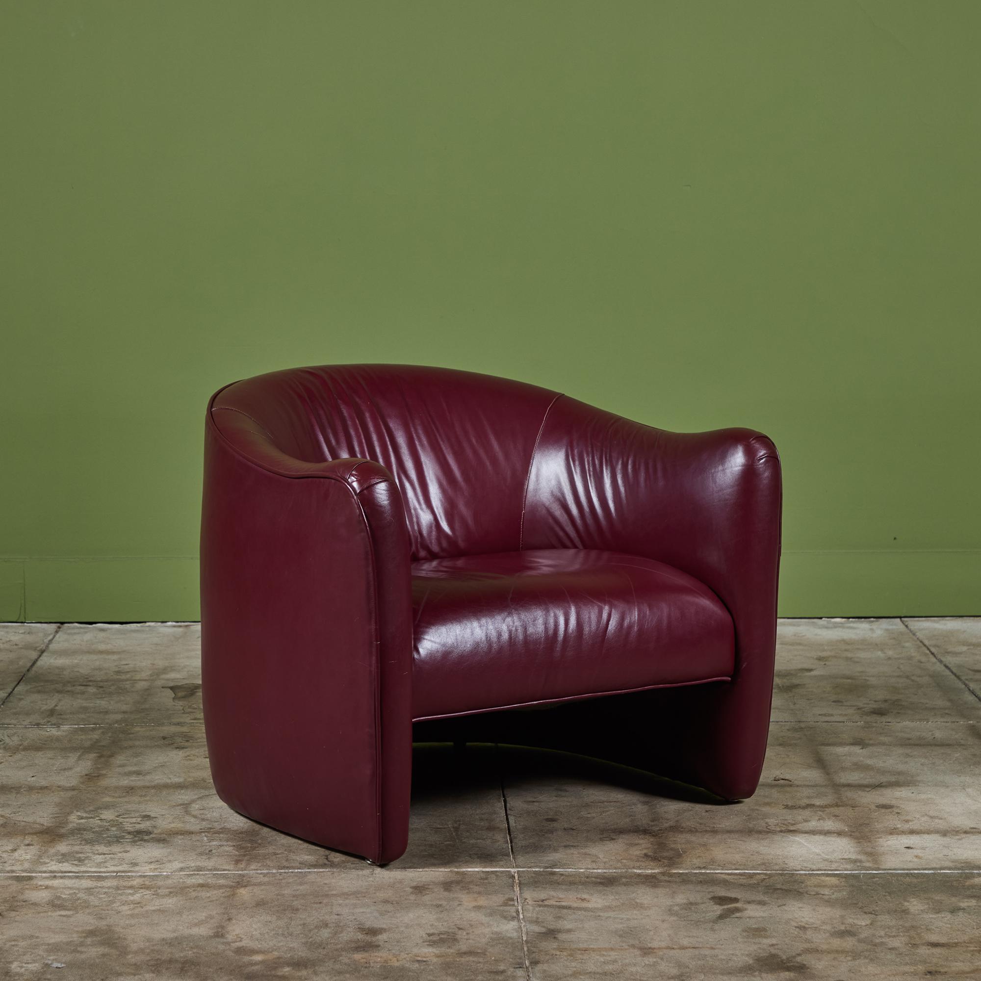 Postmodern leather club chair by San Francisco, CA-based Metropolitan Furniture, c.1970's. The chair features the original plum colored leather with a rounded seat back.

Dimensions
32