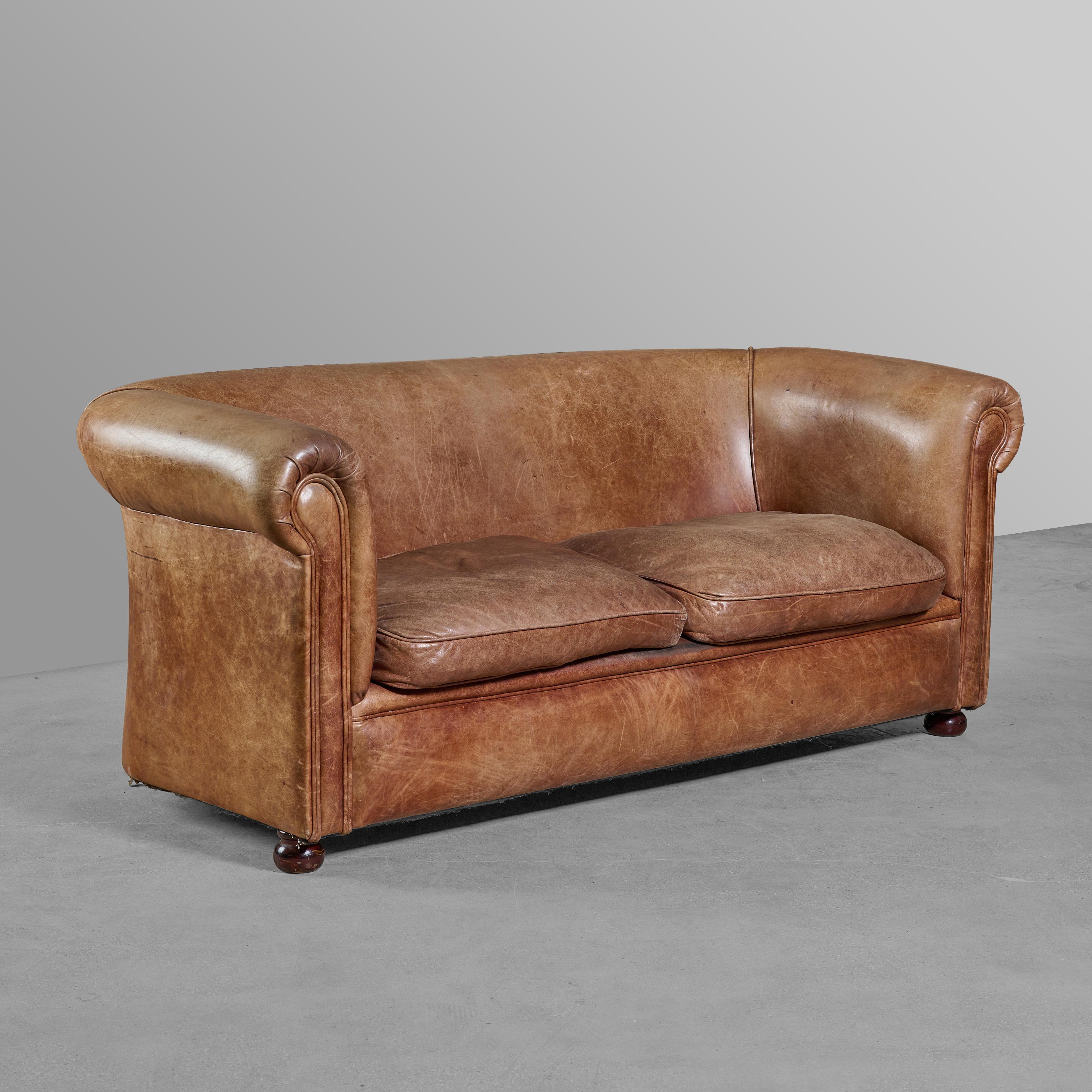 Leather and wood club style sofa. Great color and patina.


