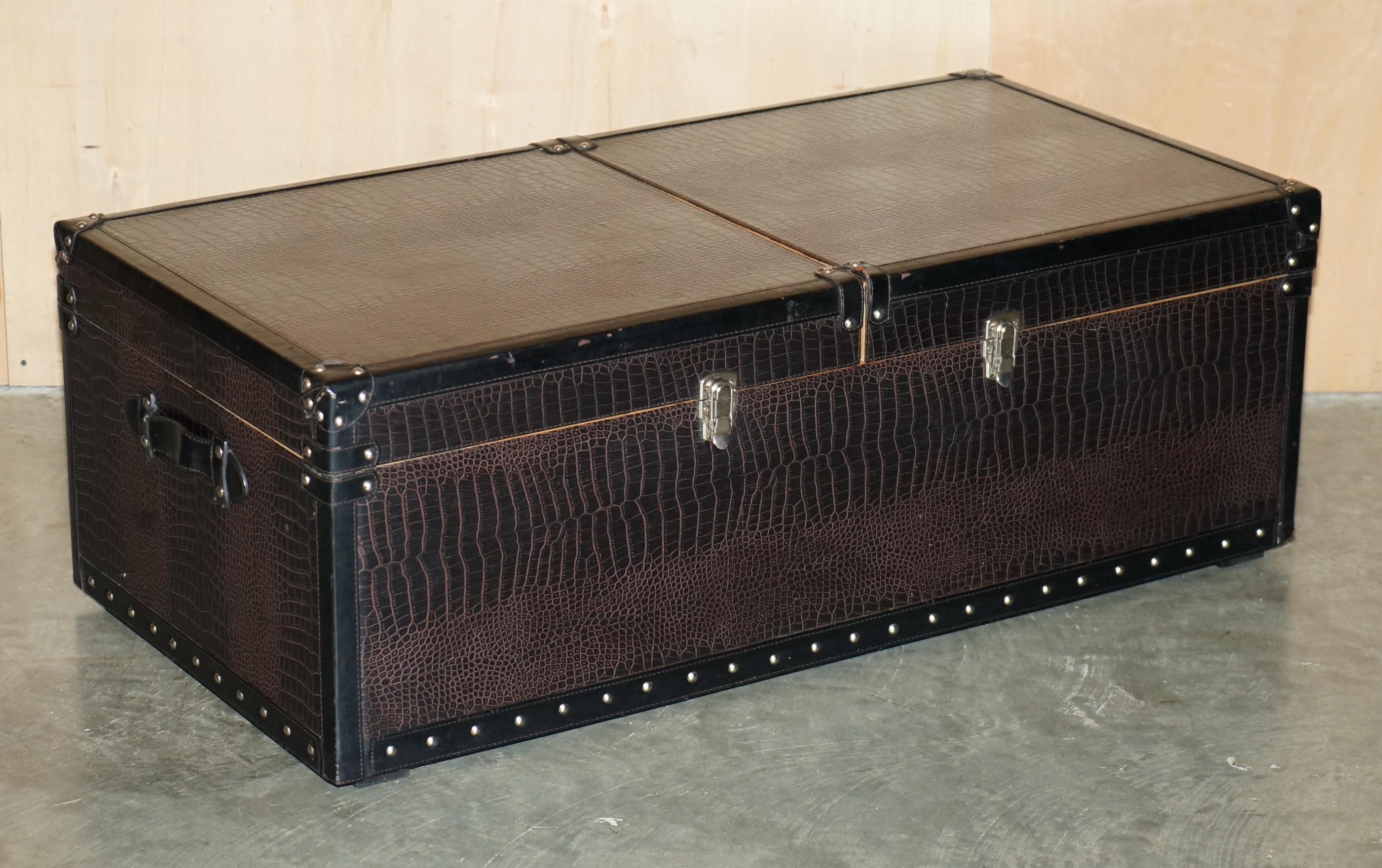 Royal House Antiques

Royal House Antiques is delighted to offer for sale this lovely brown leather with Alligator / Crocodile patina, Ash wood sliding top coffee table with internal storage which can be used as a drinks table 

Please note the