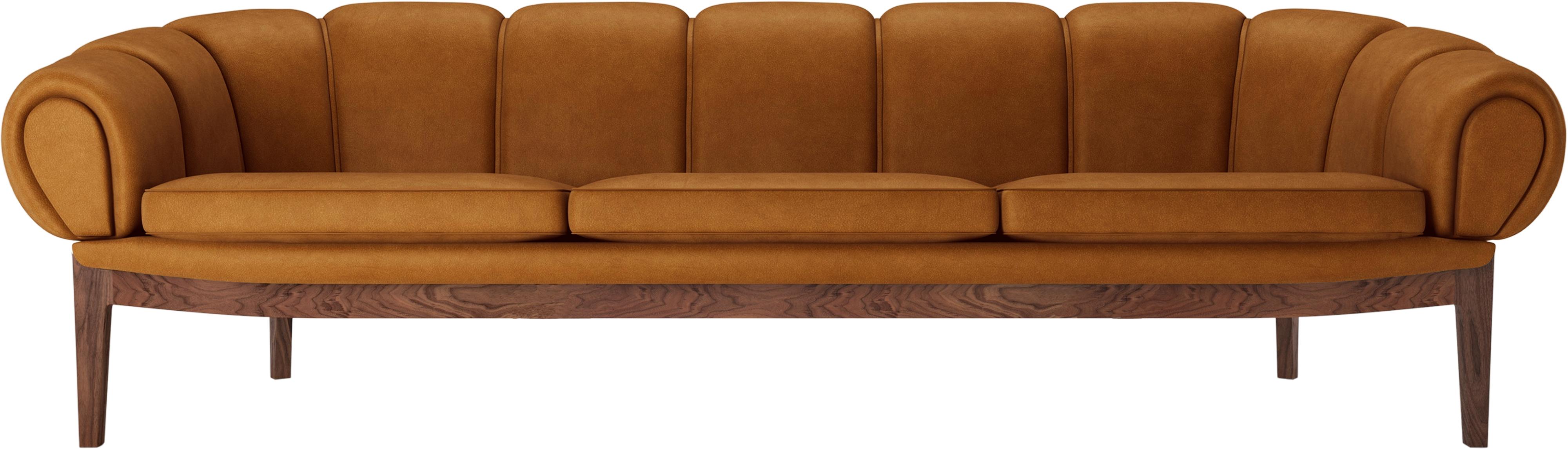 Leather 'Croissant' sofa by Illum Wikkelsø for GUBI with walnut legs.

Playful, voluptuous and expertly crafted, the newly reimagined Croissant Collection from GUBI makes a powerful statement in any interior setting and an heirloom to treasure for