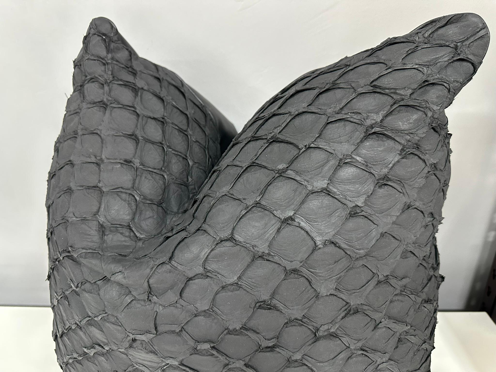 The Pirarucu fish leather cushion. Pirarucu fish comes from Brazilian food industry, it is the second largest river fish in the world after the beluga. Vegetable taning and dyed with anilines. Down feather insert. 

Sizes variable and made to