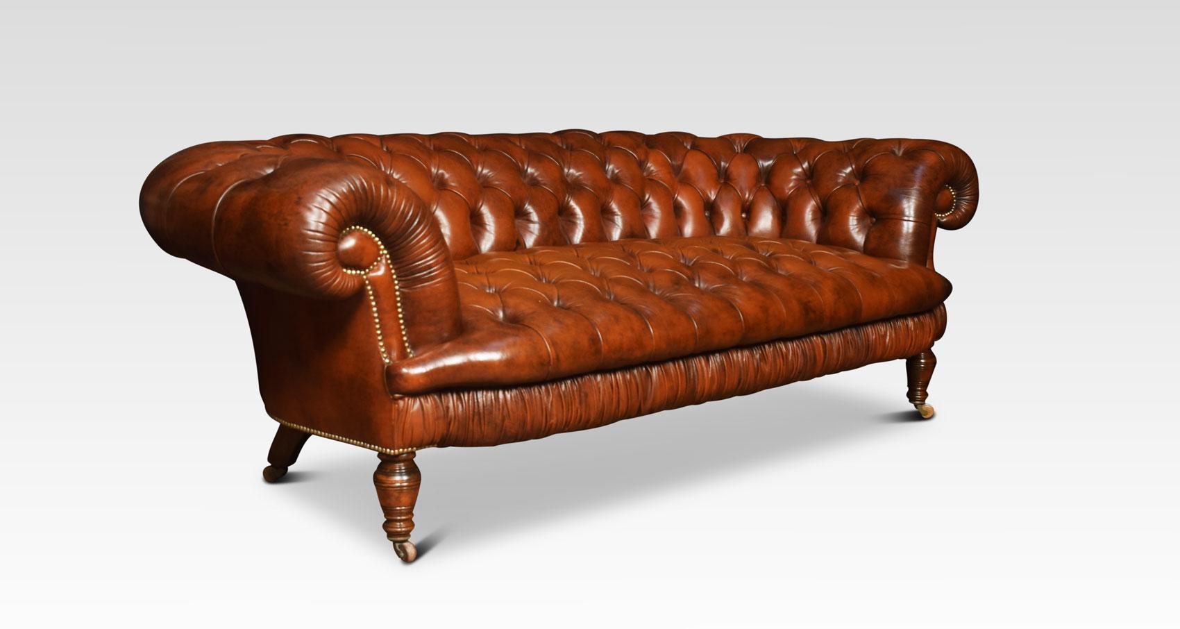 Large three-seat brown leather Chesterfield sofa, having deep buttoned back and seat, raised up on turned feet with brass ceramic castors. Good solid condition, the leather is soft, nicely worn in.
Dimensions:
Height 29 inches height to seat 20.5