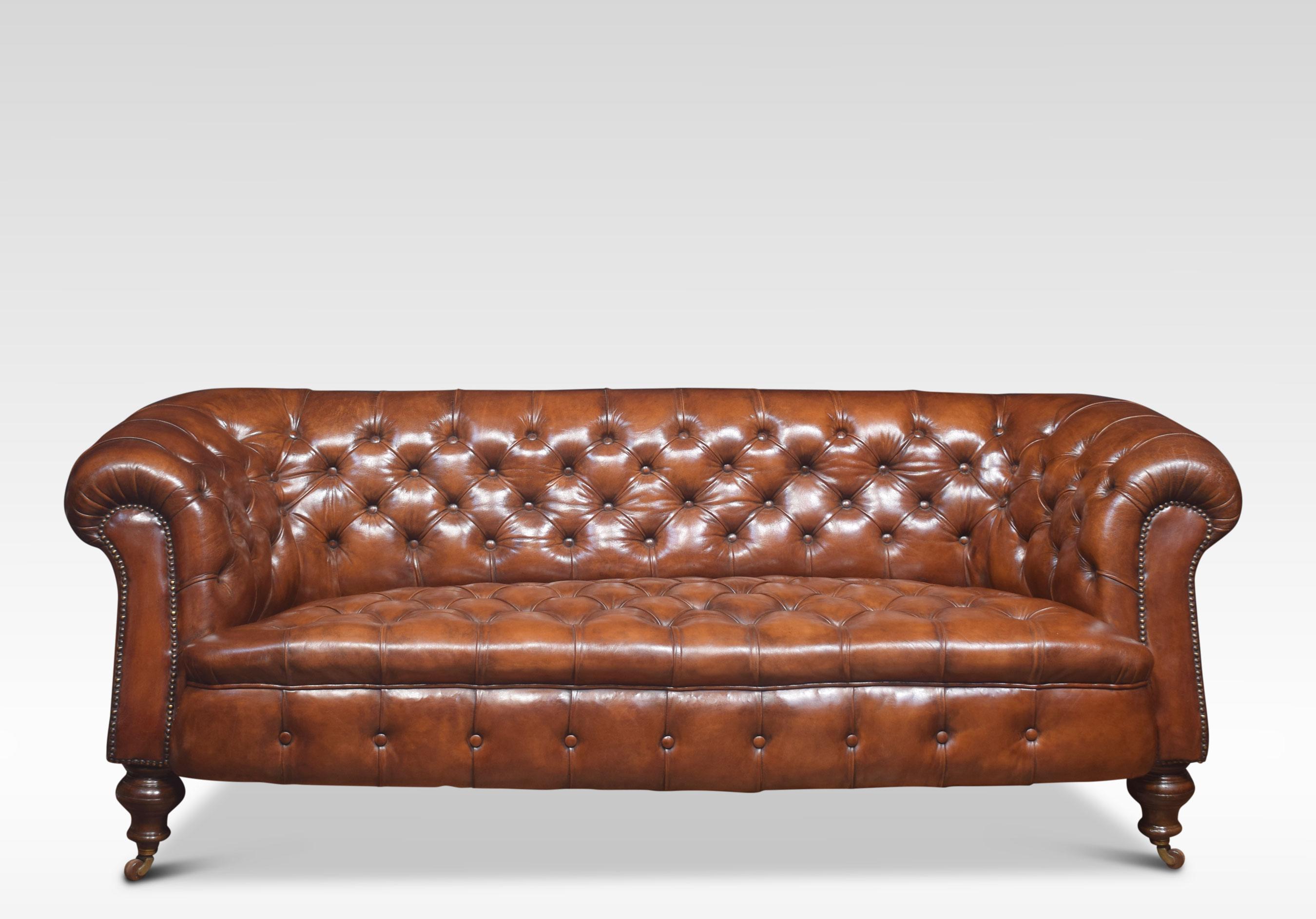 Very large brown leather Chesterfield sofa, having deep buttoned back and seat, raised up on turned feet with brass ceramic castors. In good solid condition, the leather has been replaced and hand-dyed.
Dimensions:
Height 31.5 inches height to