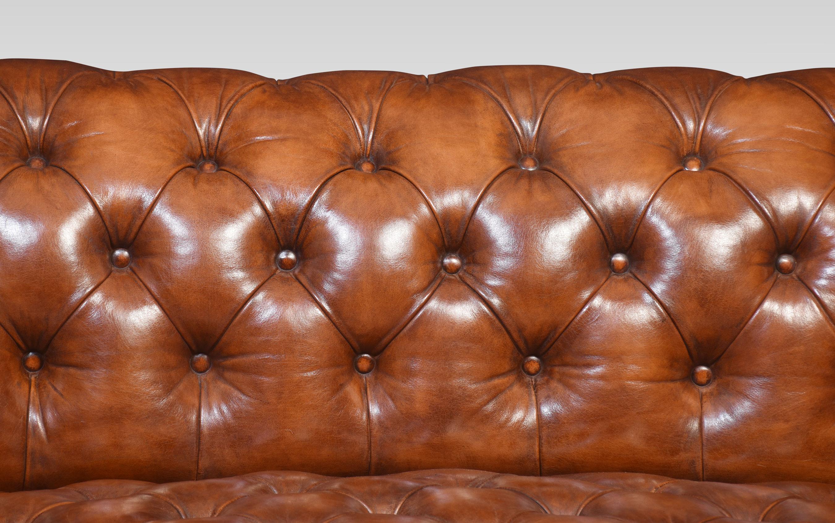 Large brown leather Chesterfield sofa, having deep buttoned back and seat, raised up on turned feet with brass ceramic castors. Good solid condition, the leather has been replaced and hand-dyed.
Dimensions
Height 30 Inches height to seat 17