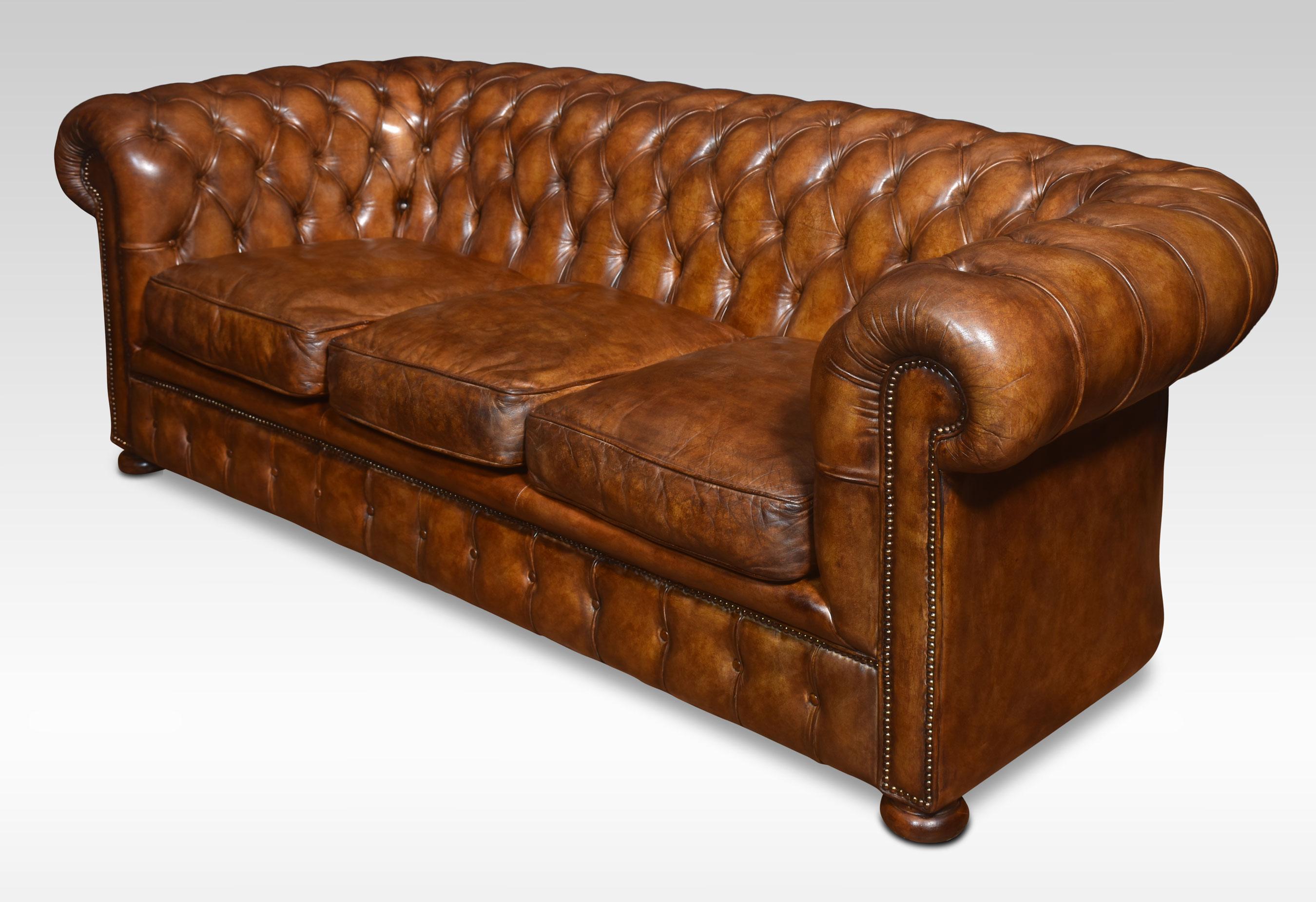 Large brown leather Chesterfield sofa, having deep buttoned back, arms and removable cushions. All raised up on turned feet. Good solid condition, and the leather is soft, and nicely worn in.
Dimensions
Height 30.5 Inches height to seat 19