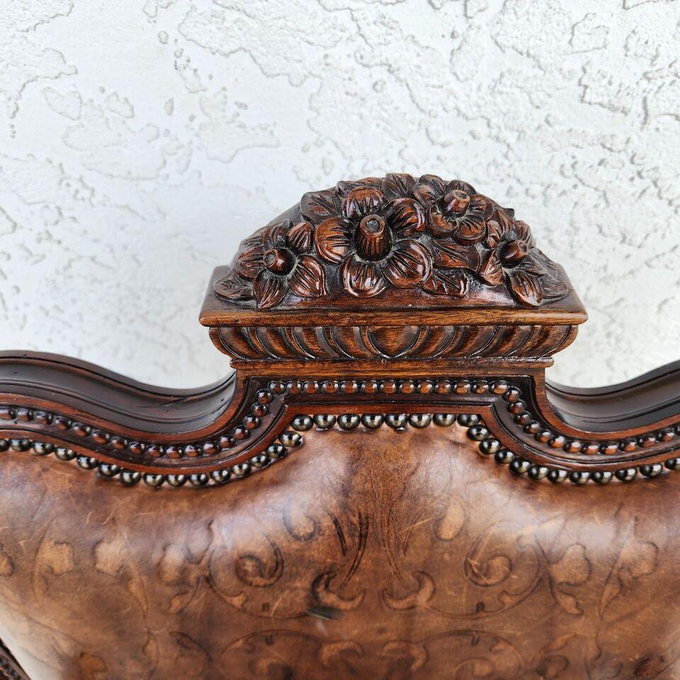 For FULL item description click on CONTINUE READING at the bottom of this page.

Offering One Of Our Recent Palm Beach Estate Fine Furniture Acquisitions Of An
Embossed Leather Desk Armchair by Maitland Smith
With detailed carvings and an embossed