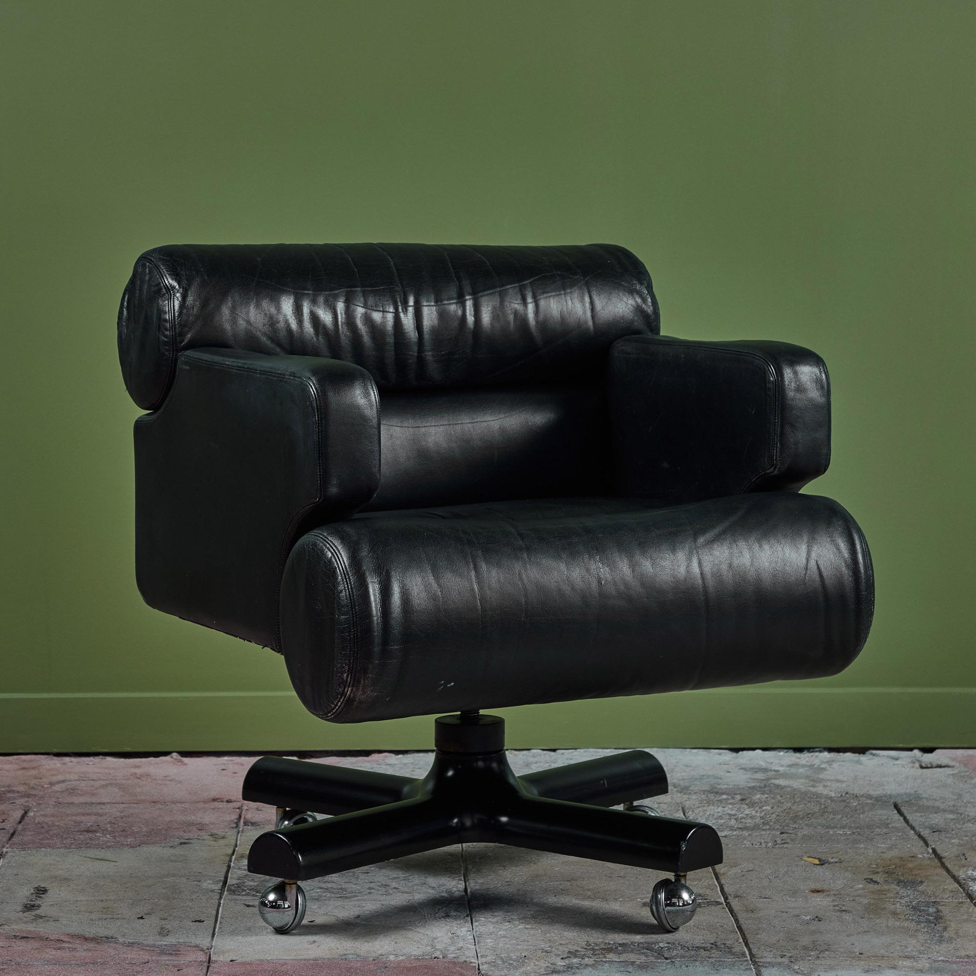 Executive desk chair by William Lancing Plumb for Marble Imperial Furniture, 1960's, USA. This plush desk chair features original black leather upholstery and cushions. The chair offers an adjustable seat height with a tilt swivel mechanism and sits