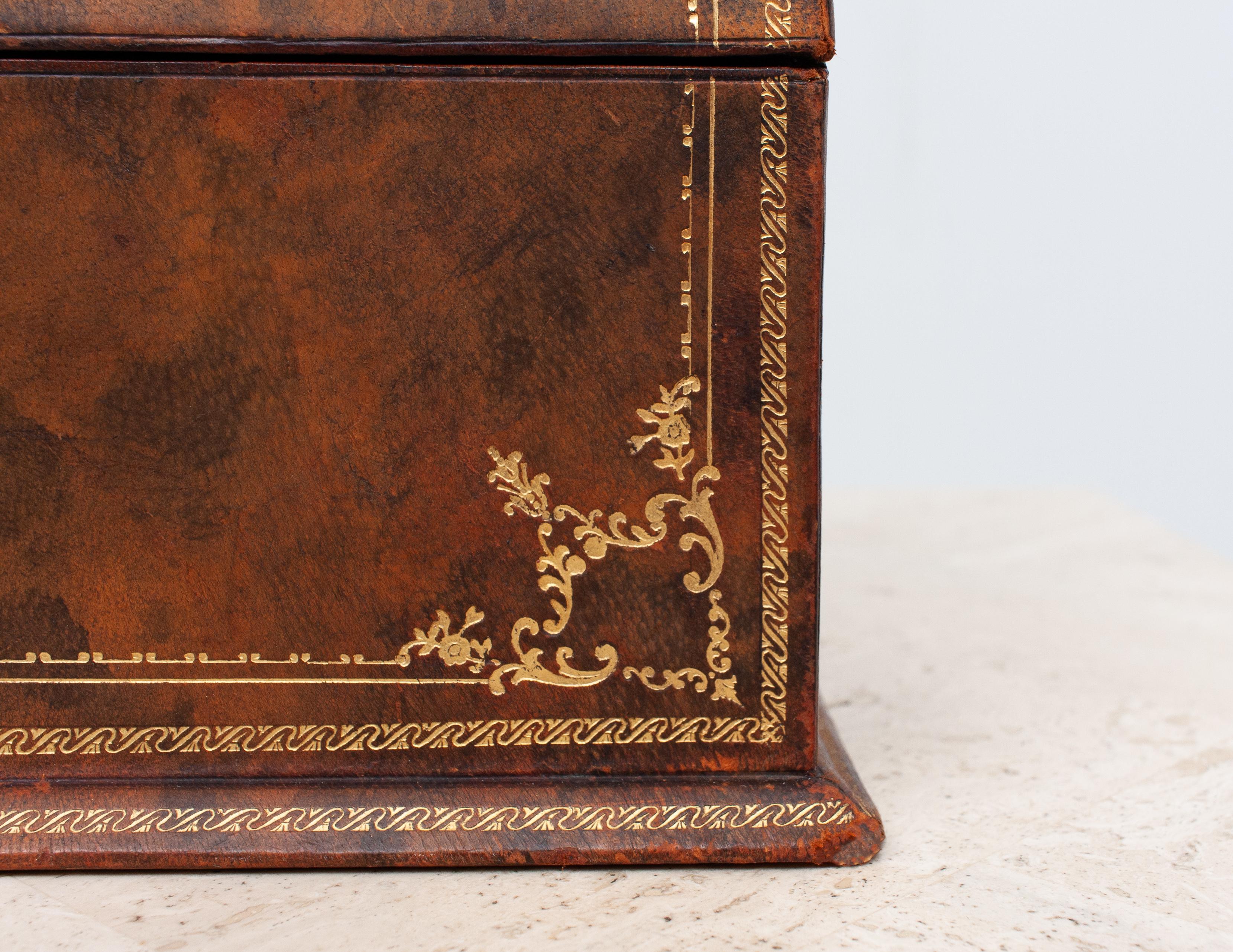 Leather desk letter holder box with gold embossing, 1950s. Italy. Very nice warm color.
Great looking piece, on your desk. some wear on the Silk lining inside.
 