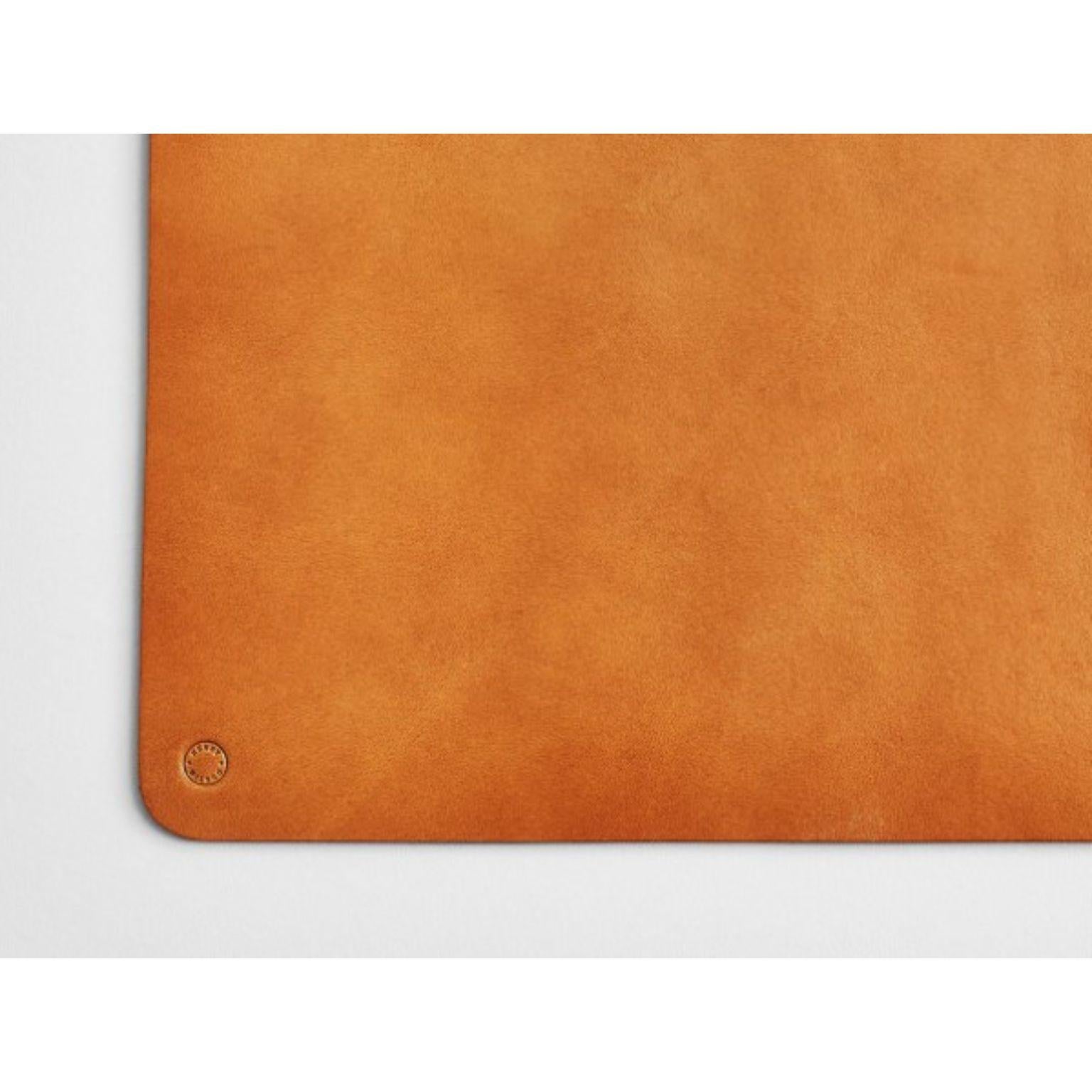 Leather Desk Mat Tan by Henry Wilson
Dimensions: D32 x H22
Materials: Leather

Our leather desk mats are made of vegetable tanned saddle leather imported from Italy. This type of leather is thick and durable, and its ‘half-dressed’ state