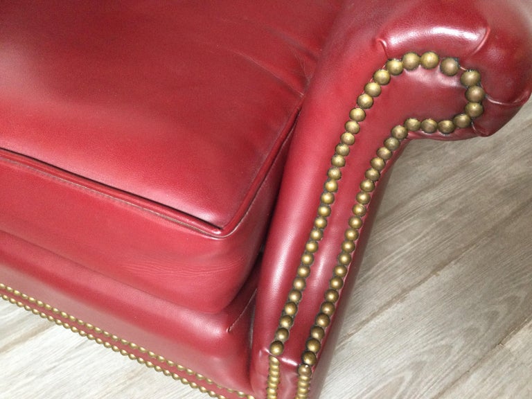 20th Century Leather Devon Style Wing Chair with Brass Nail Head Trim For Sale