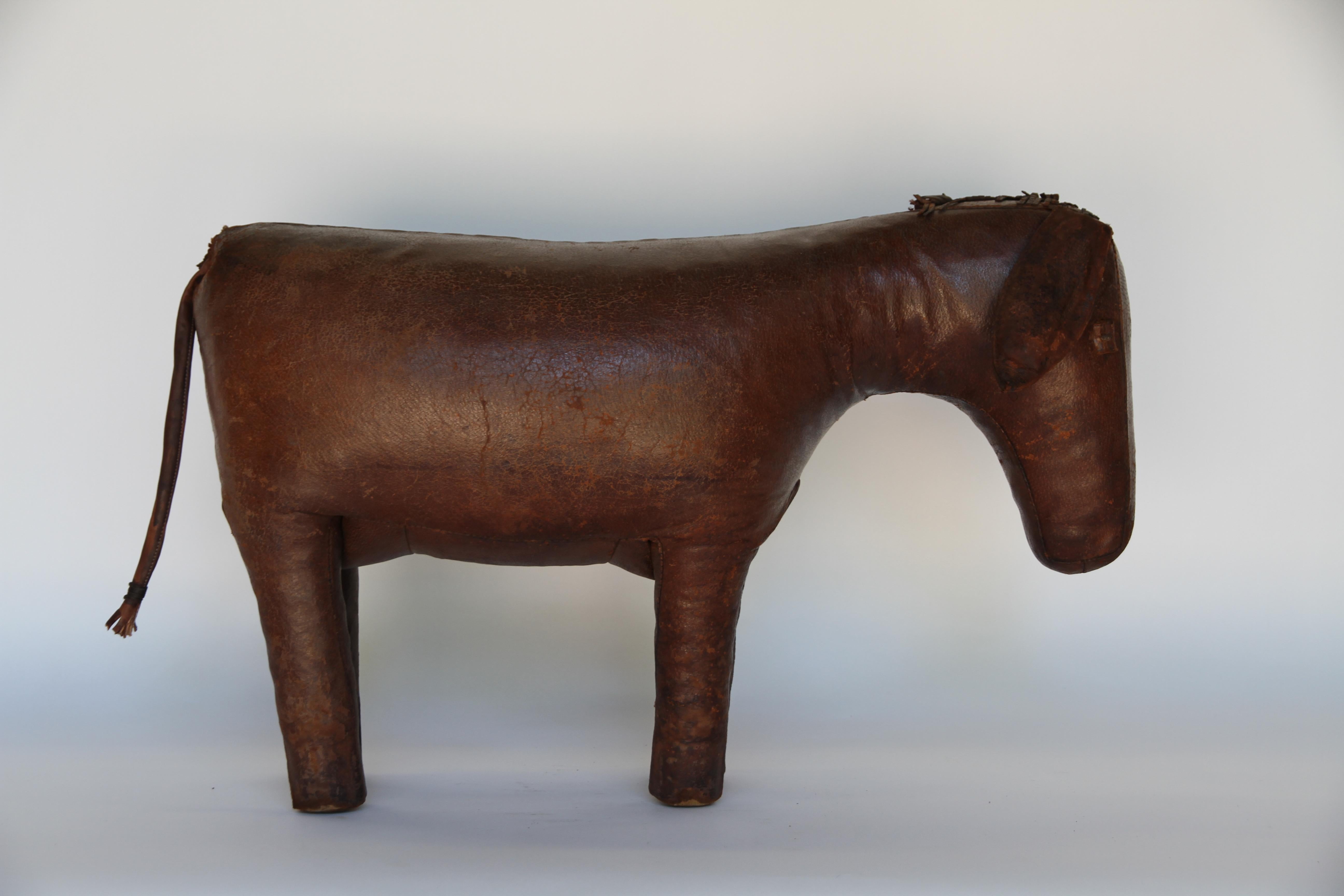 Beautiful leather donkey footstool by Dimitri Omersa. Omersa Co. in England produced several leather animals as footstools for Abercrombie and Fitch. This sweet donkey is a wonderful conversation piece as well as useful as a footrest.