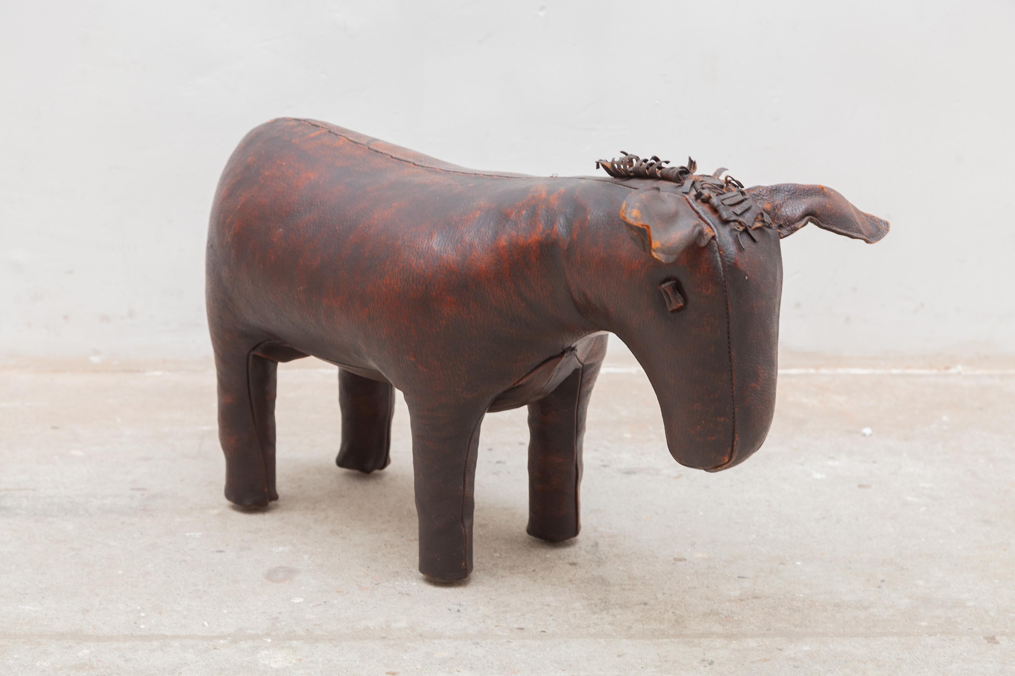 Early example Donkey in original leather ottoman by Dimitri Omersa for Liberty's of London manufactured by Abercrombie and Fitch in England, 1965. The leather is soft and supple with a beautiful aged patina.

The pig was the first produced animal