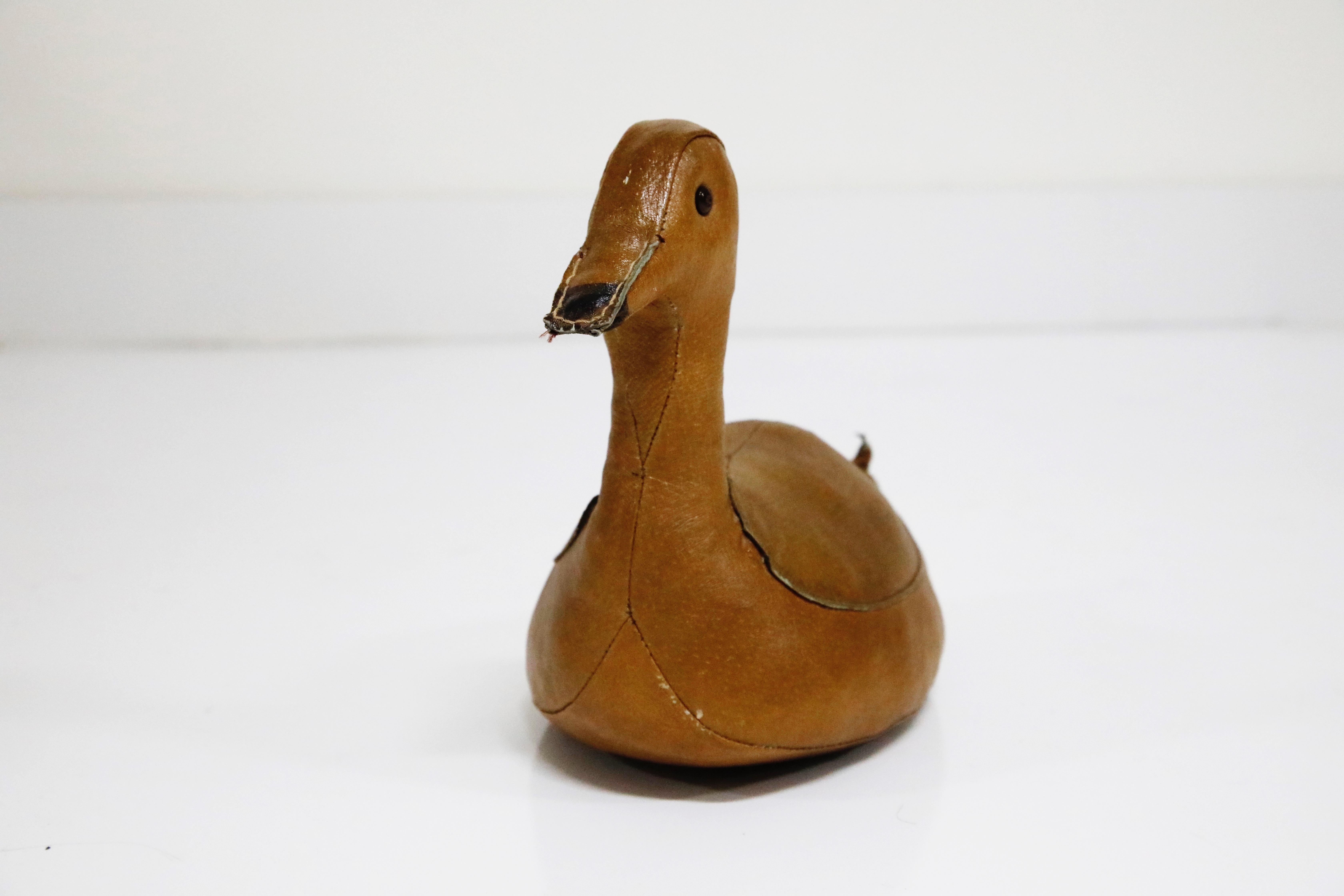 A wonderful example of the leather duck doorstop (or paper weight) by Dimitri Omersa for Abercrombie and Fitch, circa 1950s. This is a collectible early production example and ready to be used as a floor door stop or consider using it as a tabletop