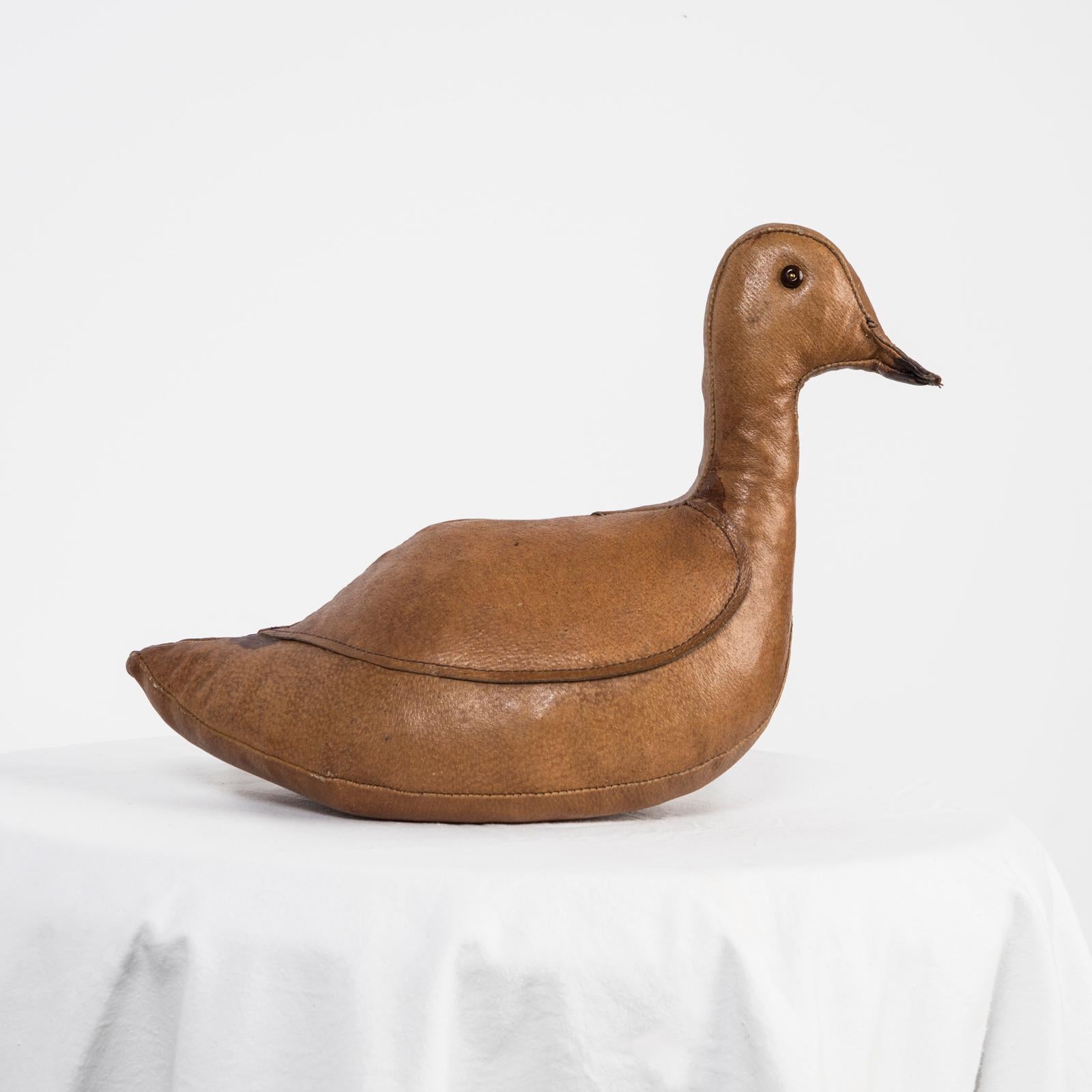 A wonderful example of the leather duck doorstop (or paper weight) by Dimitri Omersa for Abercrombie and Fitch, circa 1950s.

This is a collectible early production example and ready to be used as a floor door stop or consider using it as a tabletop