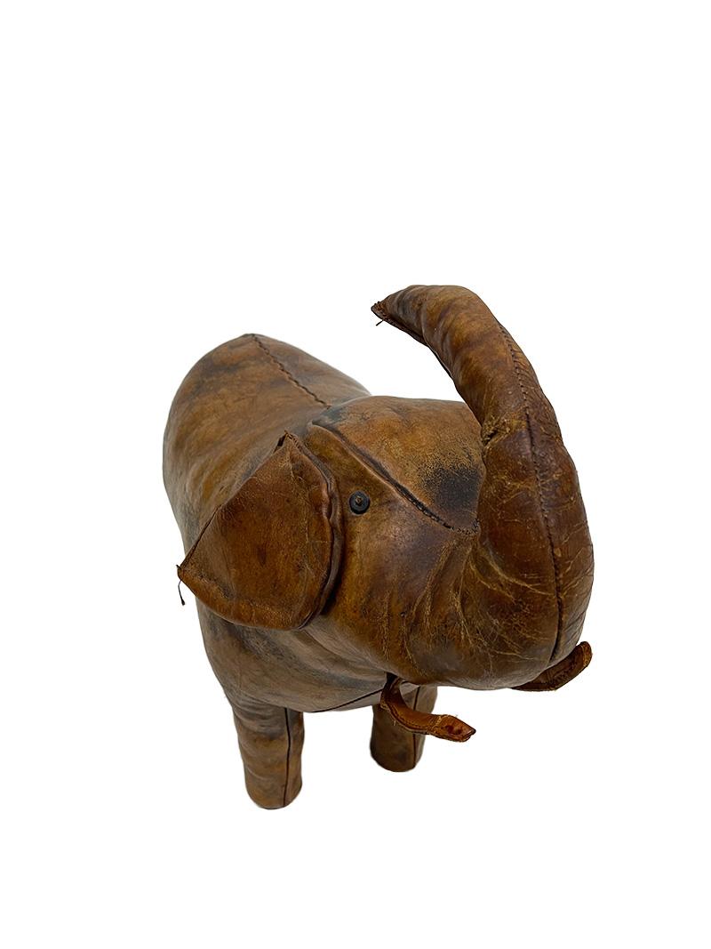 Leather Elephant small footstool, by Dimitri Omersa, 1960s

An Elephant footstool, made in brown leather and firmly filled with straw, by Dimitri Omersa, 1960s
The elephant was the first piece designed by Dimitri Omersa when it took over the art