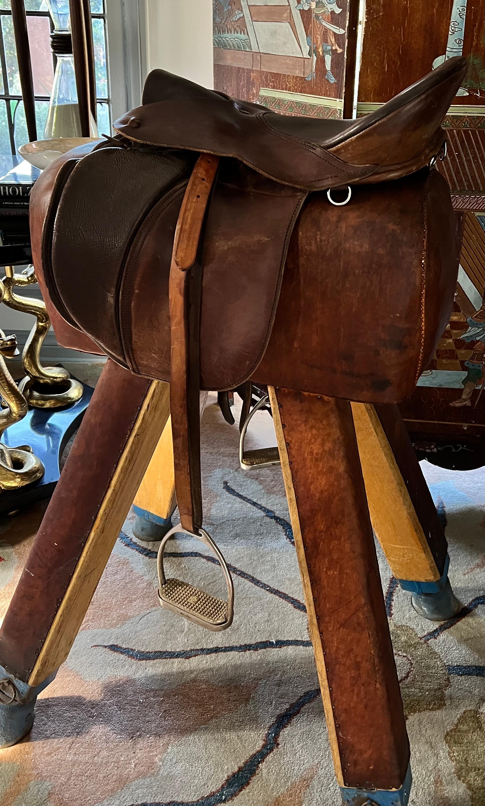 English Riding Saddle - All Leather by the Ansur Saddle Company.   The style is the The Elite...

The piece was acquired from an Estate in Los Angeles - looks to be in great ridablecondition,, however we use and recommend them for decorative