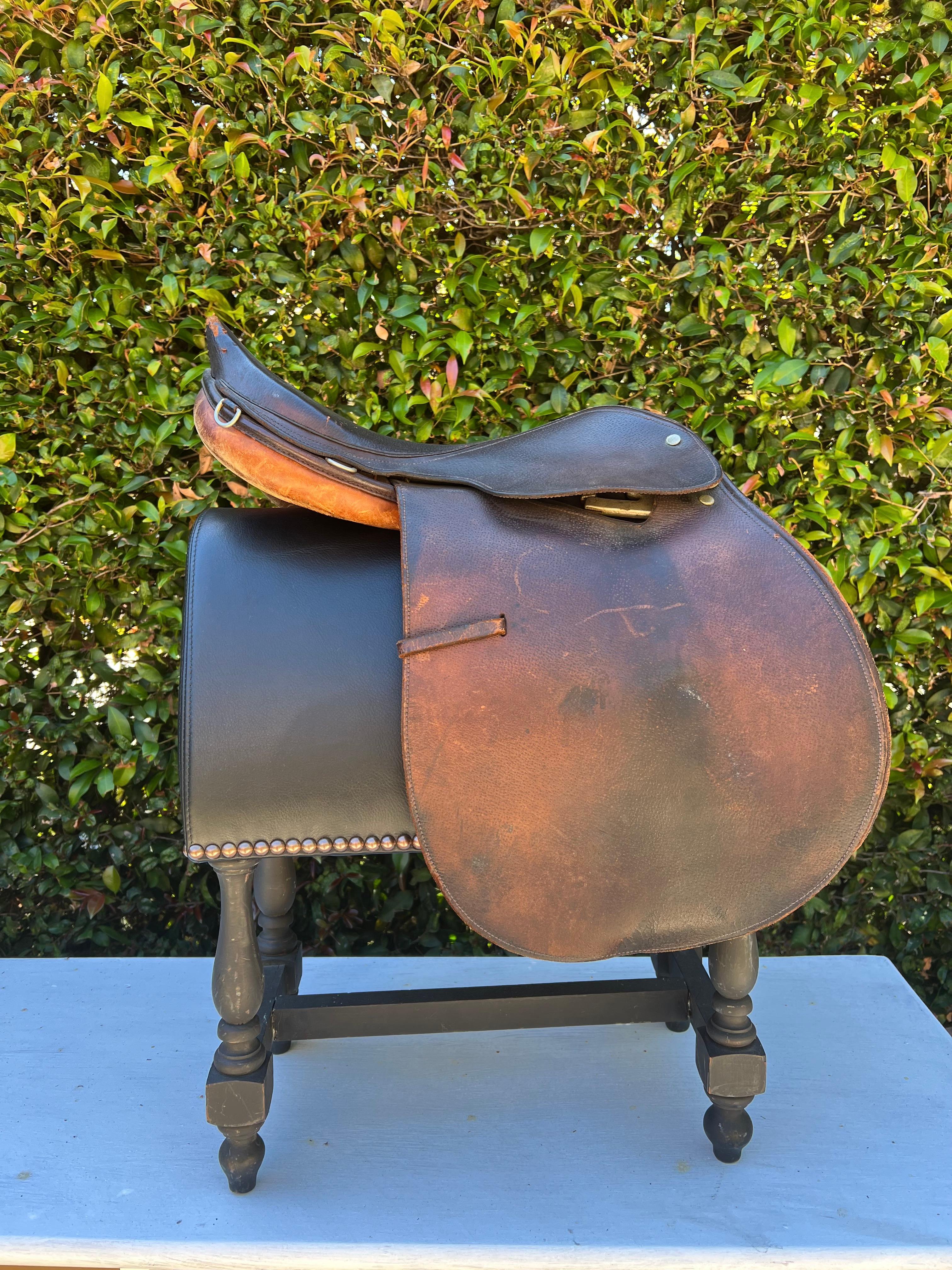 A lovely English riding saddle, and most likely best as a decorative piece.  We have made and designed a custom leather saddle stand for display in your space.... a compliment to any rustic style or cabin home... in the den, library or study.   A