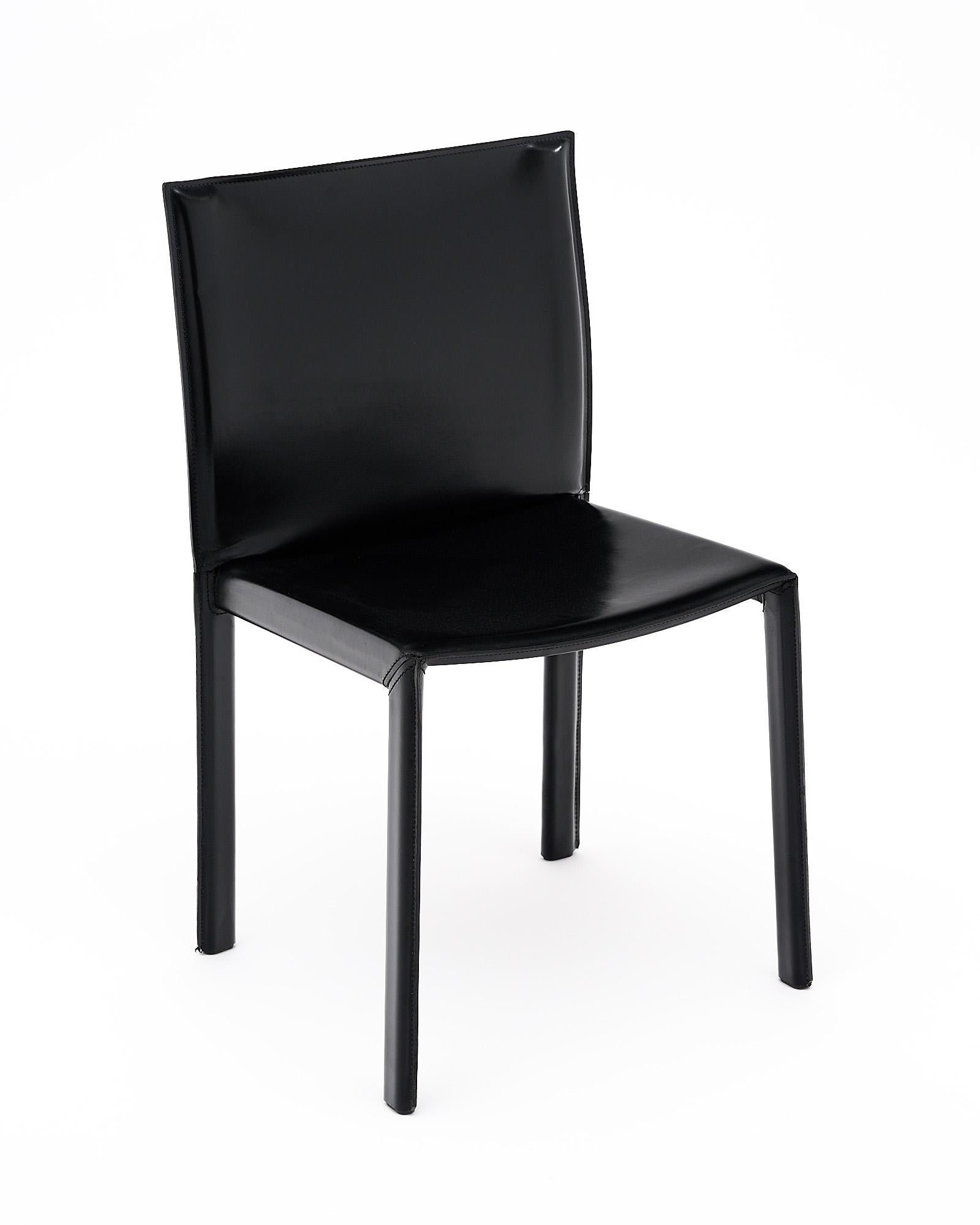 Set of four chairs made of stitched black leather, by Italian designer Enrico Pellizzoni.
