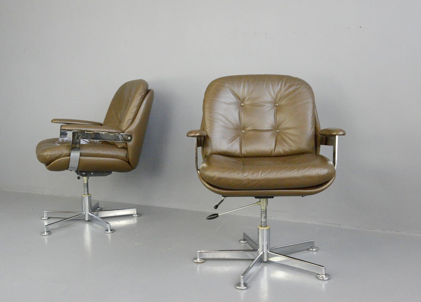 Leather executive chairs by Ring Mobelfabrikk, circa 1970s.

- Price is per chair
- Quality chocolate brown leather 
- Button back
- Height adjustable and reclining 
- Polished chrome arms and base
- Made by Ring Mobelfabrikk
- Norwegian,
