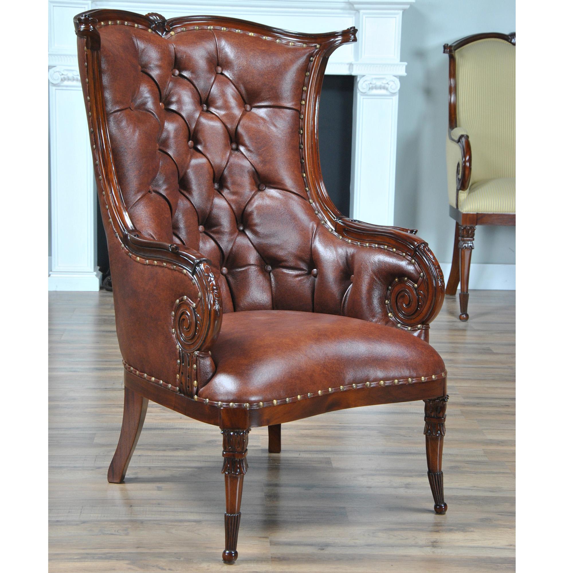 The Niagara Furniture Leather Fireside Chair is designed after an American original antique chair and ships out covered in full grained tufted genuine leather with brass nail trim. This reproduction antique has all of the features of it’s ancestral
